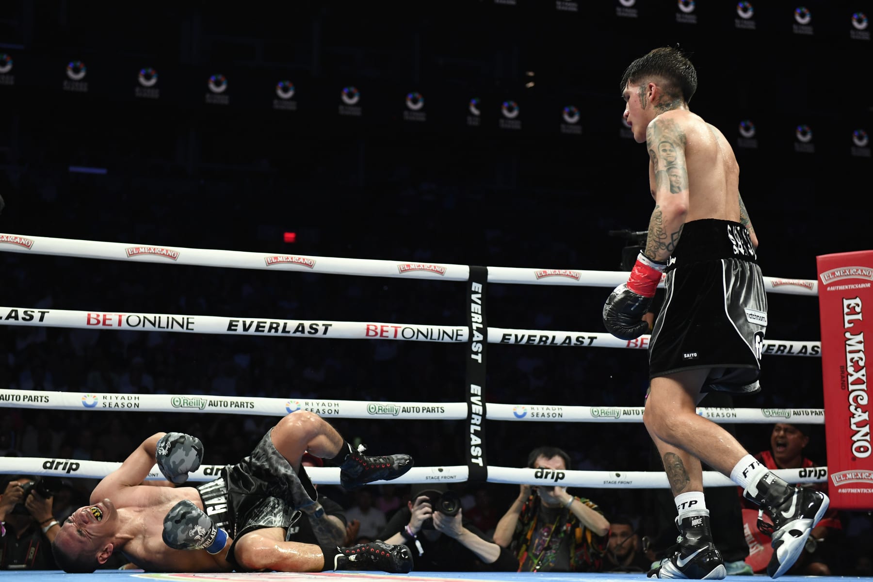 PHOENIX, ARIZONA - JUNE 29: Jesse ‘Bam’ Rodriguez of the United States knocks out Juan Francisco Estrada of Mexico in the seventh round of their WBC world and Ring Magazine super flyweight title bout at Footprint Center on June 29, 2024 in Phoenix, Arizona. (Photo by Kelsey Grant/Getty Images)