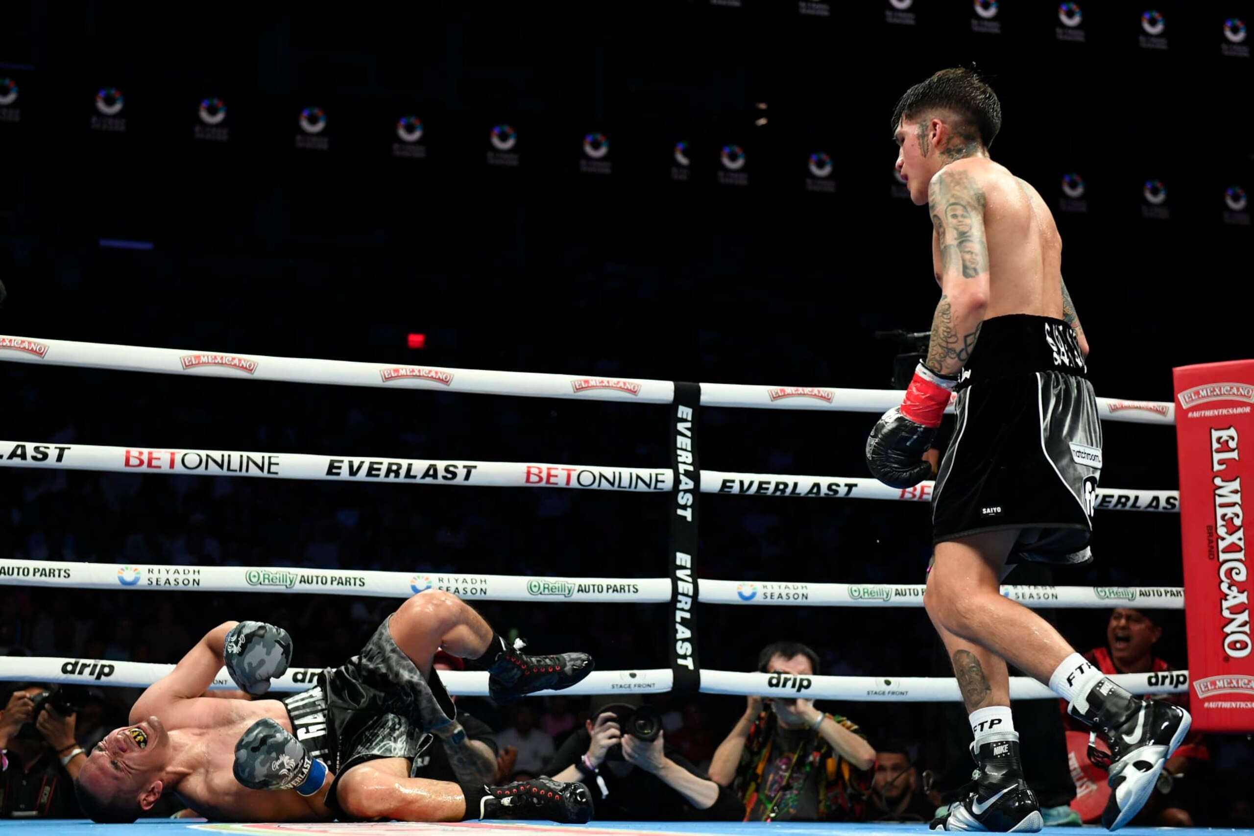 PHOENIX, ARIZONA - JUNE 29: Jesse ‘Bam’ Rodriguez of the United States knocks out Juan Francisco Estrada of Mexico in the seventh round of their WBC world and Ring Magazine super flyweight title bout at Footprint Center on June 29, 2024 in Phoenix, Arizona. (Photo by Kelsey Grant/Getty Images)