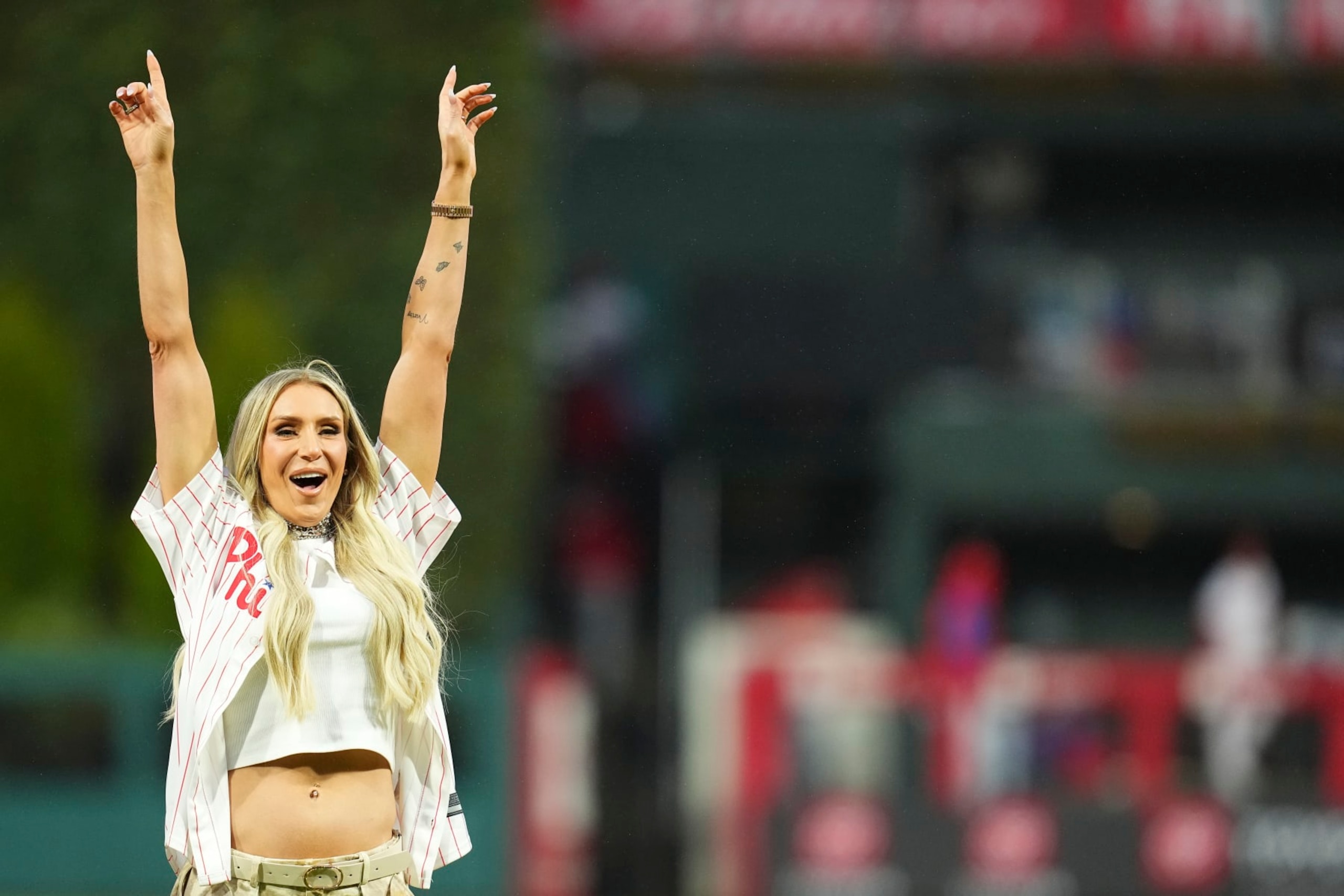 PHILADELPHIA, PENNSYLVANIA - APRIL 2: WWE wrestler Charlotte Flair reacts prior to the game between the Cincinnati Reds and Philadelphia Phillies at Citizens Bank Park on April 2, 2024 in Philadelphia, Pennsylvania. The Phillies defeated the Reds 9-4. (Photo by Mitchell Leff/Getty Images)
