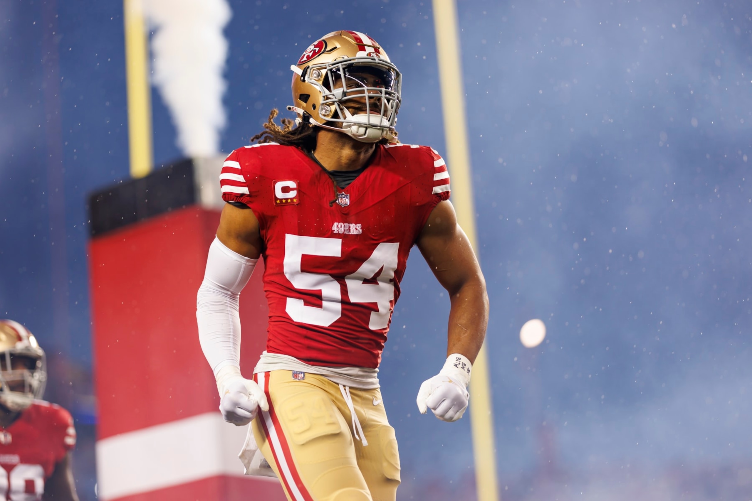 SANTA CLARA, CALIFORNIA - JANUARY 20: Fred Warner #54 of the San Francisco 49ers celebrates as he runs onto the field during team entrances before an NFL divisional round playoff football game against the Green Bay Packers at Levi's Stadium on January 20, 2024 in Santa Clara, California. (Photo by Ryan Kang/Getty Images)