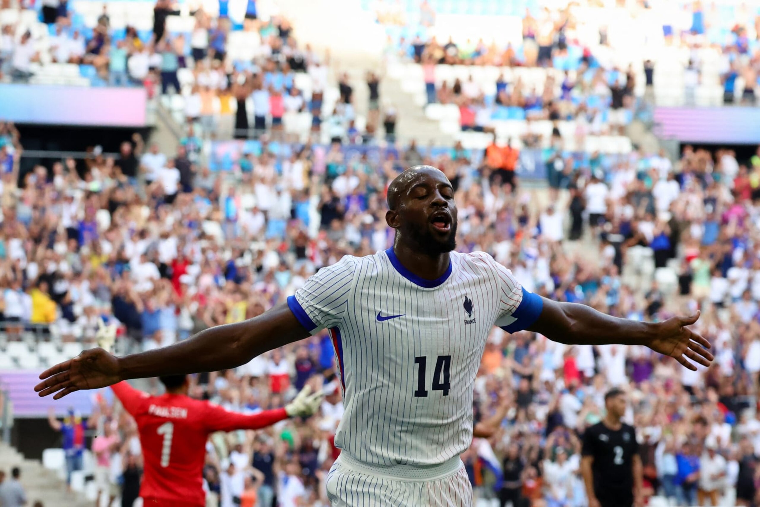 France's forward #14 Jean-Philippe Mateta celebrates after scoring his team first goal during the Paris 2024 Olympic Games men's group A football match between New Zealand and France, at the Marseille Stadium, in Marseille, southern France, on July 30, 2024. (Photo by Clement MAHOUDEAU / AFP) (Photo by CLEMENT MAHOUDEAU/AFP via Getty Images)