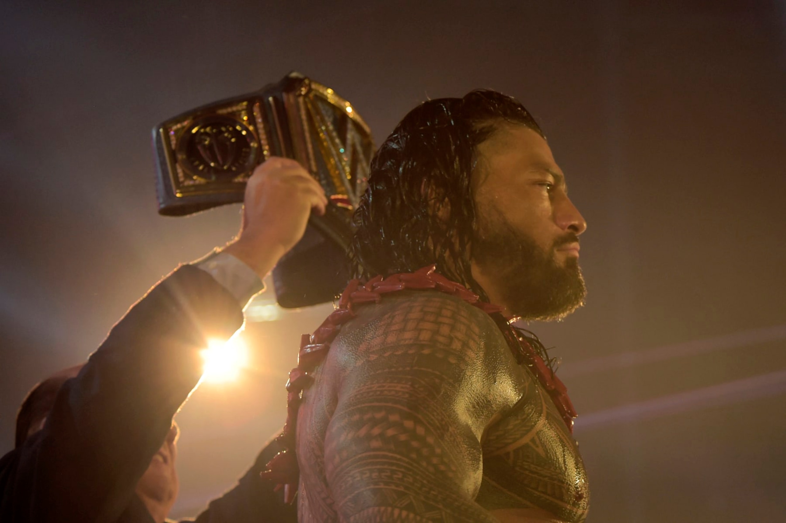 Roman Reigns wins a match during the 2022 WWE Elimination Chamber at the Jeddah Super Dome in Saudi Arabia's Red Sea coastal city of Jeddah on February 19, 2022. (Photo by Amer HILABI / AFP) (Photo by AMER HILABI/AFP via Getty Images)