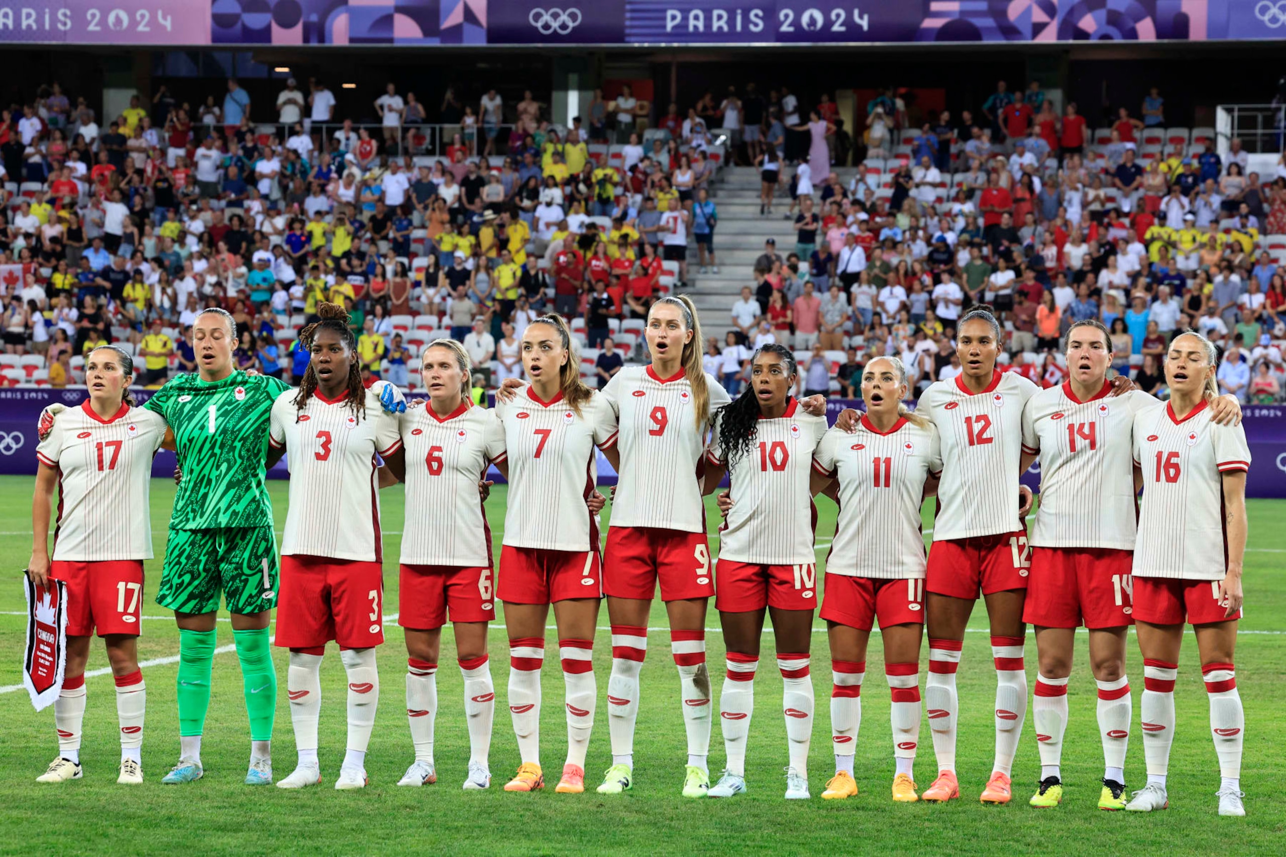 (FromL) Canada's players, midfielder #17 Jessie Fleming, goalkeeper #01 Kailen Sheridan, defender #03 Kadeisha Buchanan, forward #06 Cloe Lacasse, midfielder #07 Julia Grosso, forward #09 Jordyn Huitema, defender #10 Ashley Lawrence, forward #11 Adriana Leon, defender #12 Jade Rose, defender #14 Vanessa Gilles and forward #16 Janine Beckie pose before the women's group A football match between Colombia and Canada of the Paris 2024 Olympic Games at the Nice Stadium in Nice on July 31, 2024. (Photo by Valery HACHE / AFP) (Photo by VALERY HACHE/AFP via Getty Images)