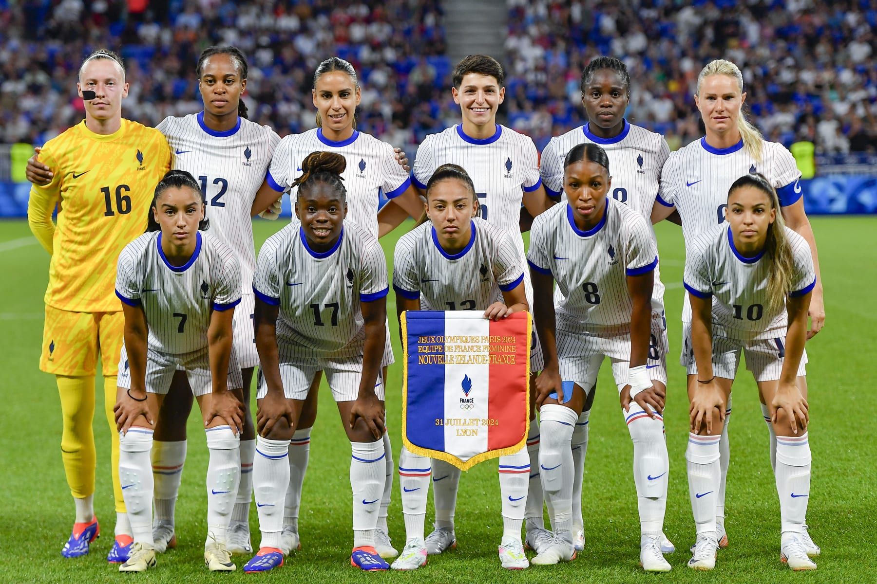 LYON, FRANCE - JULY 31: (L-R) Pauline Peyraud-Magnin, Marie-Antoinette Katoto, Maelle Lakrar, Elisa de Almeida, Griedge Mbock Bathy, Amandine Henry, Sakina Karchaoui, Sandy Baltimore, Selma Bacha, Grace Geyoro and Delphine Cascarino of France pose for a team photo prior to the Women's group A match between New Zealand and France during the Olympic Games Paris 2024 at Stade de Lyon on July 31, 2024 in Lyon, France. (Photo by Eurasia Sport Images/Getty Images)