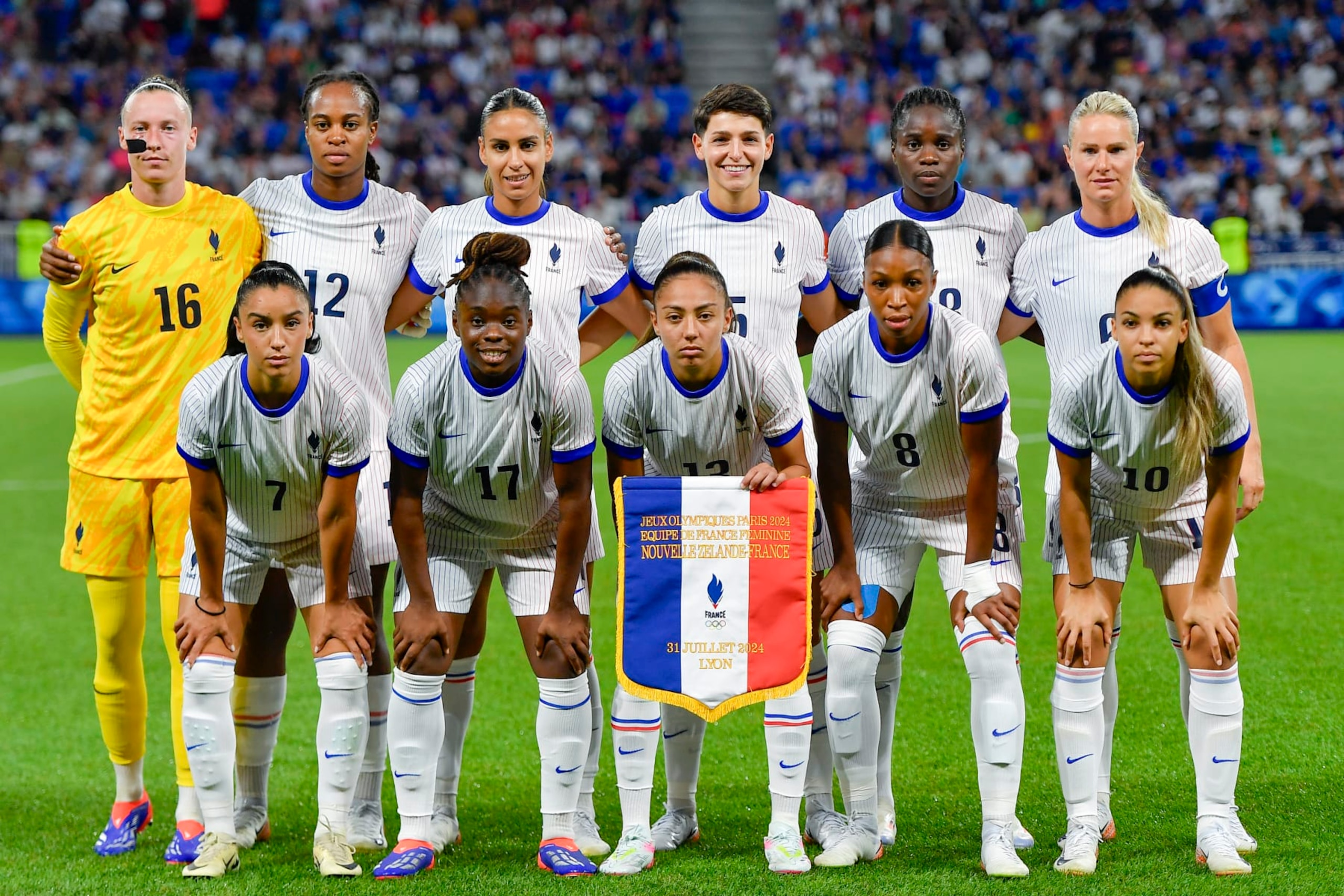 LYON, FRANCE - JULY 31: (L-R) Pauline Peyraud-Magnin, Marie-Antoinette Katoto, Maelle Lakrar, Elisa de Almeida, Griedge Mbock Bathy, Amandine Henry, Sakina Karchaoui, Sandy Baltimore, Selma Bacha, Grace Geyoro and Delphine Cascarino of France pose for a team photo prior to the Women's group A match between New Zealand and France during the Olympic Games Paris 2024 at Stade de Lyon on July 31, 2024 in Lyon, France. (Photo by Eurasia Sport Images/Getty Images)