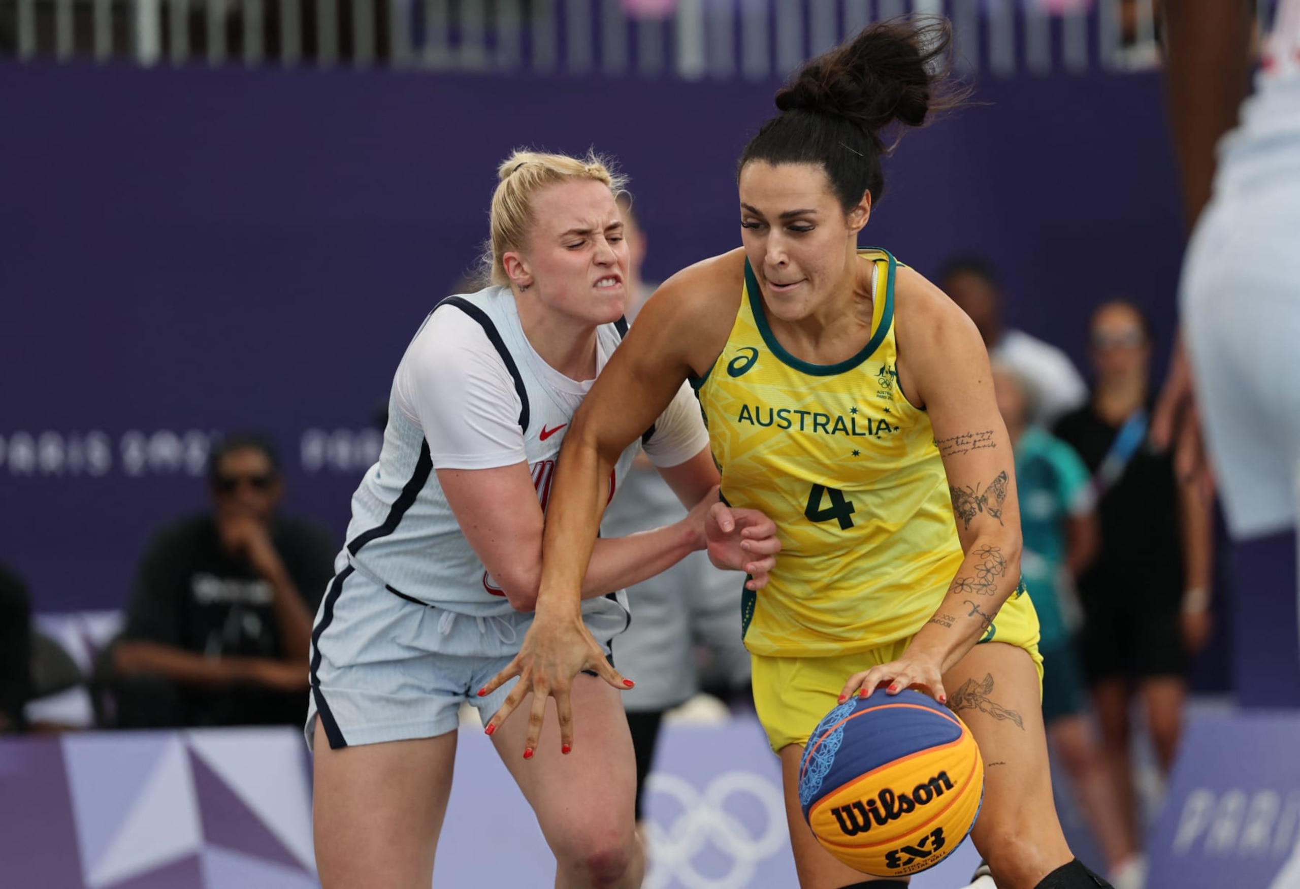 US' #09 Hailey van Lith (L) tries to block Australia's #04 Alex Wilson in the women's pool round 3x3 basketball game between the USA and Australia during the Paris 2024 Olympic Games at La Concorde in Paris on August 1, 2024. (Photo by David GRAY / AFP) (Photo by DAVID GRAY/AFP via Getty Images)