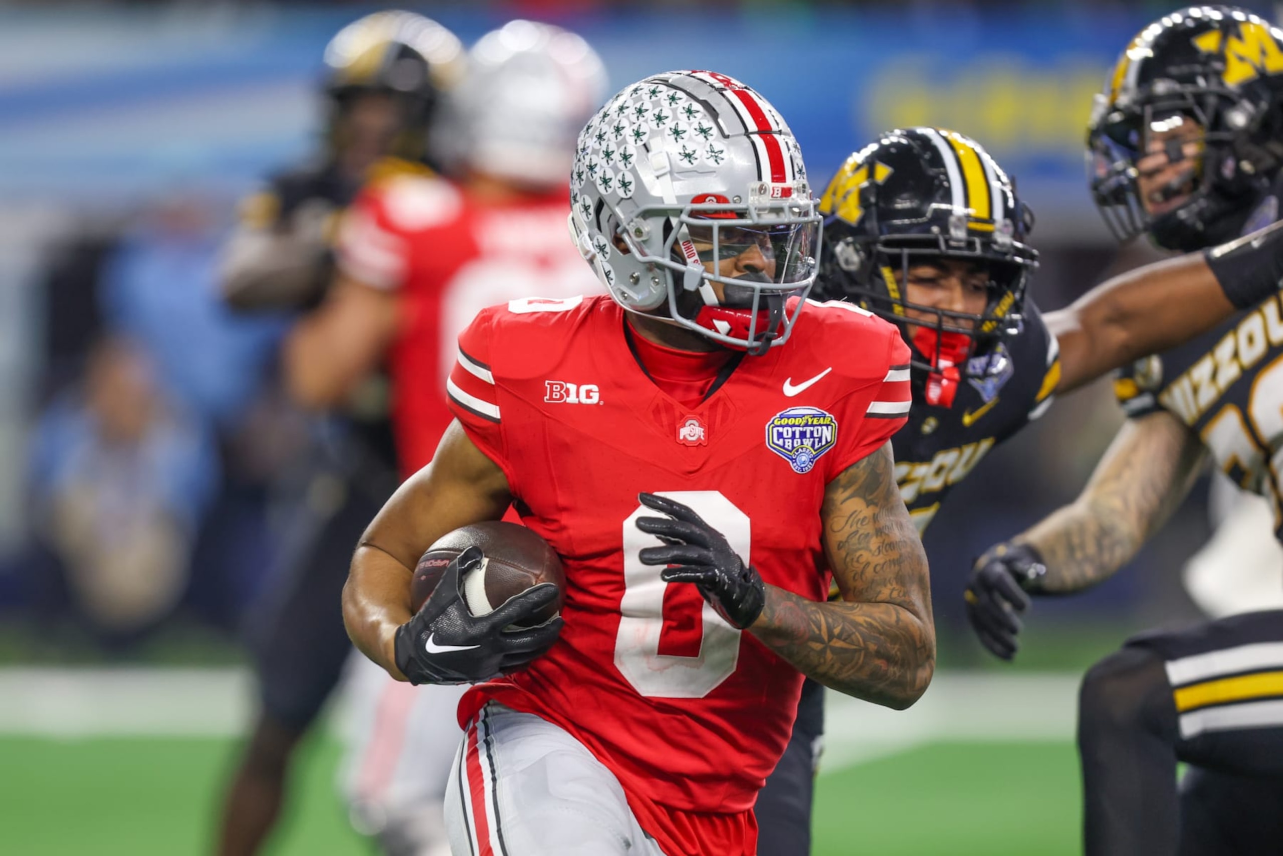 ARLINGTON, TX - DECEMBER 29: Ohio State Buckeyes wide receiver Xavier Johnson (0) carries the ball during the 88th Goodyear Cotton Bowl Classic between the Missouri Tigers and Ohio State Buckeyes on December 29, 2023 at AT&T Stadium in Arlington, TX. (Photo by George Walker/Icon Sportswire via Getty Images)