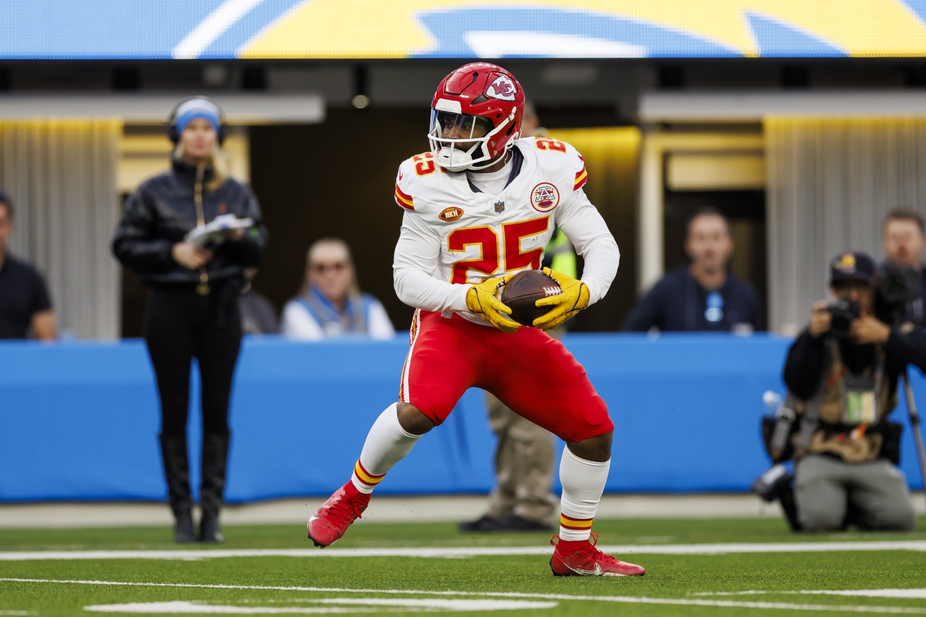 INGLEWOOD, CALIFORNIA - JANUARY 07: Clyde Edwards-Helaire #25 of the Kansas City Chiefs carries the ball on a run play during an NFL football game against the Los Angeles Chargers at SoFi Stadium on January 7, 2024 in Inglewood, California. (Photo by Ryan Kang/Getty Images)