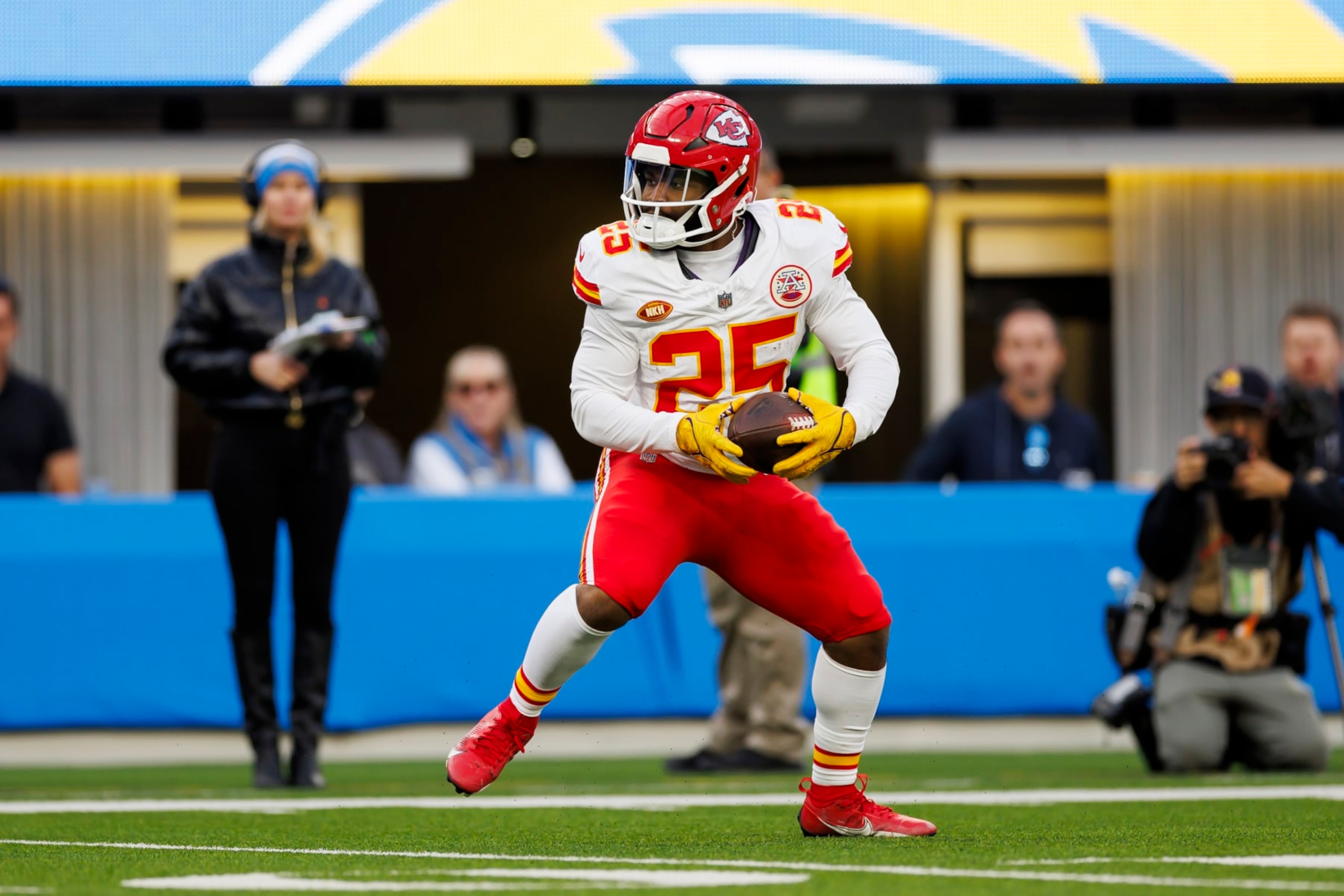 INGLEWOOD, CALIFORNIA - JANUARY 07: Clyde Edwards-Helaire #25 of the Kansas City Chiefs carries the ball on a run play during an NFL football game against the Los Angeles Chargers at SoFi Stadium on January 7, 2024 in Inglewood, California. (Photo by Ryan Kang/Getty Images)
