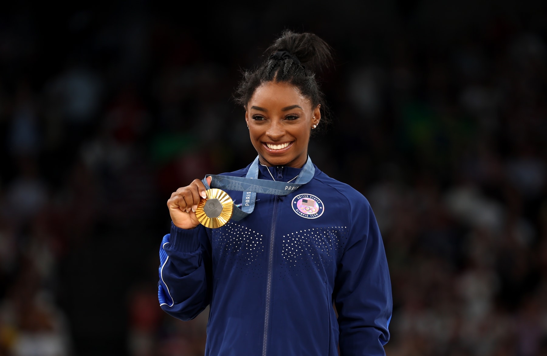 PARIS, FRANCE - AUGUST 01: Gold medalist Simone Biles of Team United States poses during the Artistic Gymnastics Women's All-Around medal ceremony on day six of the Olympic Games Paris 2024 at Bercy Arena on August 01, 2024 in Paris, France. (Photo by Jamie Squire/Getty Images)