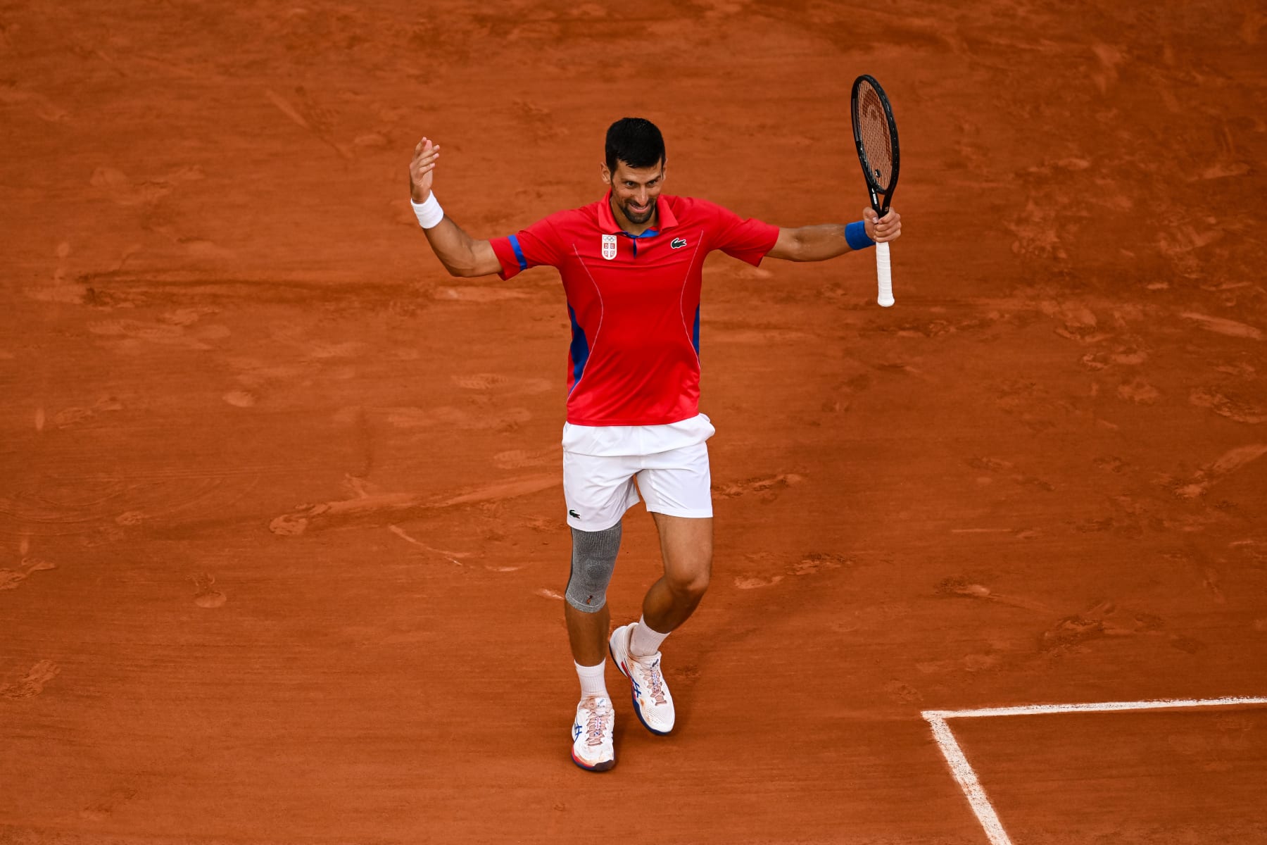 PARIS, FRANCE - AUGUST 01: Novak Djokovic of Serbia reacts against Stefanos Tsitsipas of Greece in the Men's Singles Quarter Final match on day six of the Olympic Games Paris 2024 at Roland Garros on August 01, 2024 in Paris, France. (Photo by Daniel Kopatsch/Getty Images) PARIS, FRANCE - AUGUST 01: Novak Djokovic of Serbia reacts against Stefanos Tsitsipas of Greece in the Men's Singles Quarter Final match on day six of the Olympic Games Paris 2024 at Roland Garros on August 01, 2024 in Paris, France. (Photo by Daniel Kopatsch/Getty Images)