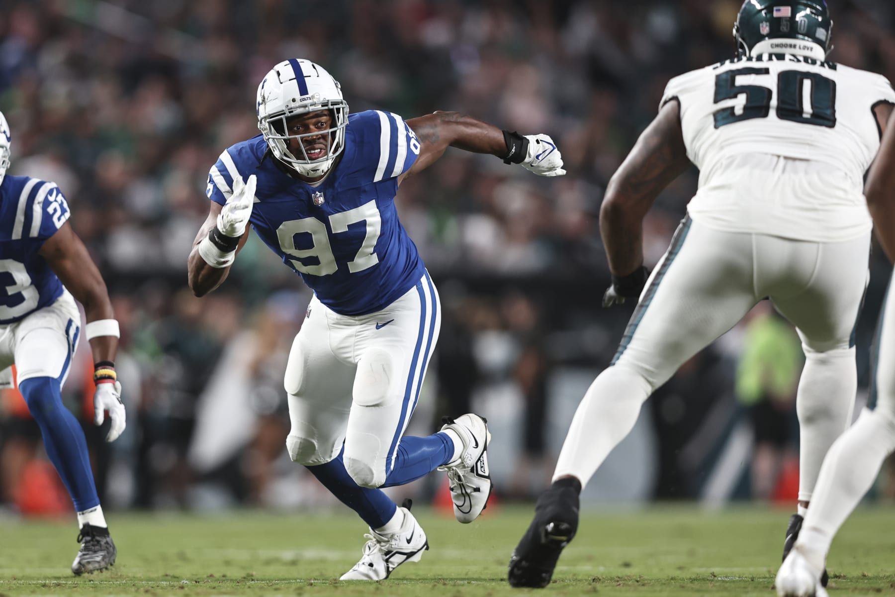 PHILADELPHIA, PENNSYLVANIA - AUGUST 24: Al-Quadin Muhammad #97 of the Indianapolis Colts rushes against Fred Johnson #50 of the Philadelphia Eagles during an NFL preseason game at Lincoln Financial Field on August 24, 2023 in Philadelphia, Pennsylvania. (Photo by Michael Owens/Getty Images)