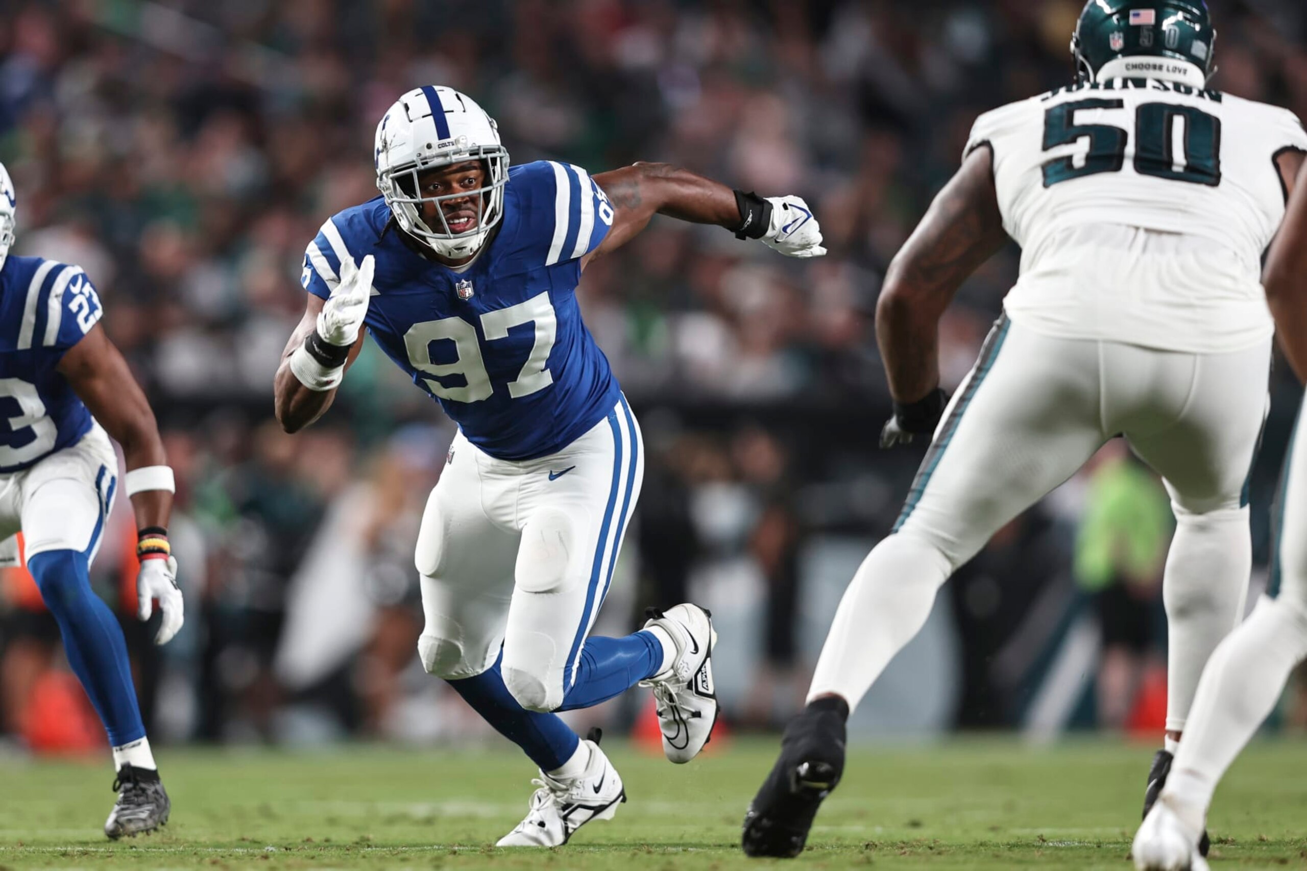 PHILADELPHIA, PENNSYLVANIA - AUGUST 24: Al-Quadin Muhammad #97 of the Indianapolis Colts rushes against Fred Johnson #50 of the Philadelphia Eagles during an NFL preseason game at Lincoln Financial Field on August 24, 2023 in Philadelphia, Pennsylvania. (Photo by Michael Owens/Getty Images)