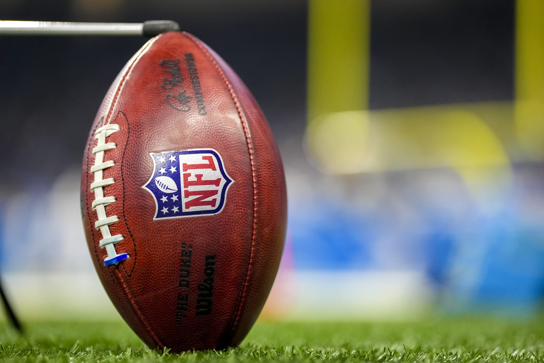 DETROIT, MICHIGAN - JANUARY 07: A detail of a Wilson brand NFL The Duke football held up by a kicking tee during the game between the Minnesota Vikings and Detroit Lions Ford Field on January 07, 2024 in Detroit, Michigan. (Photo by Nic Antaya/Getty Images)