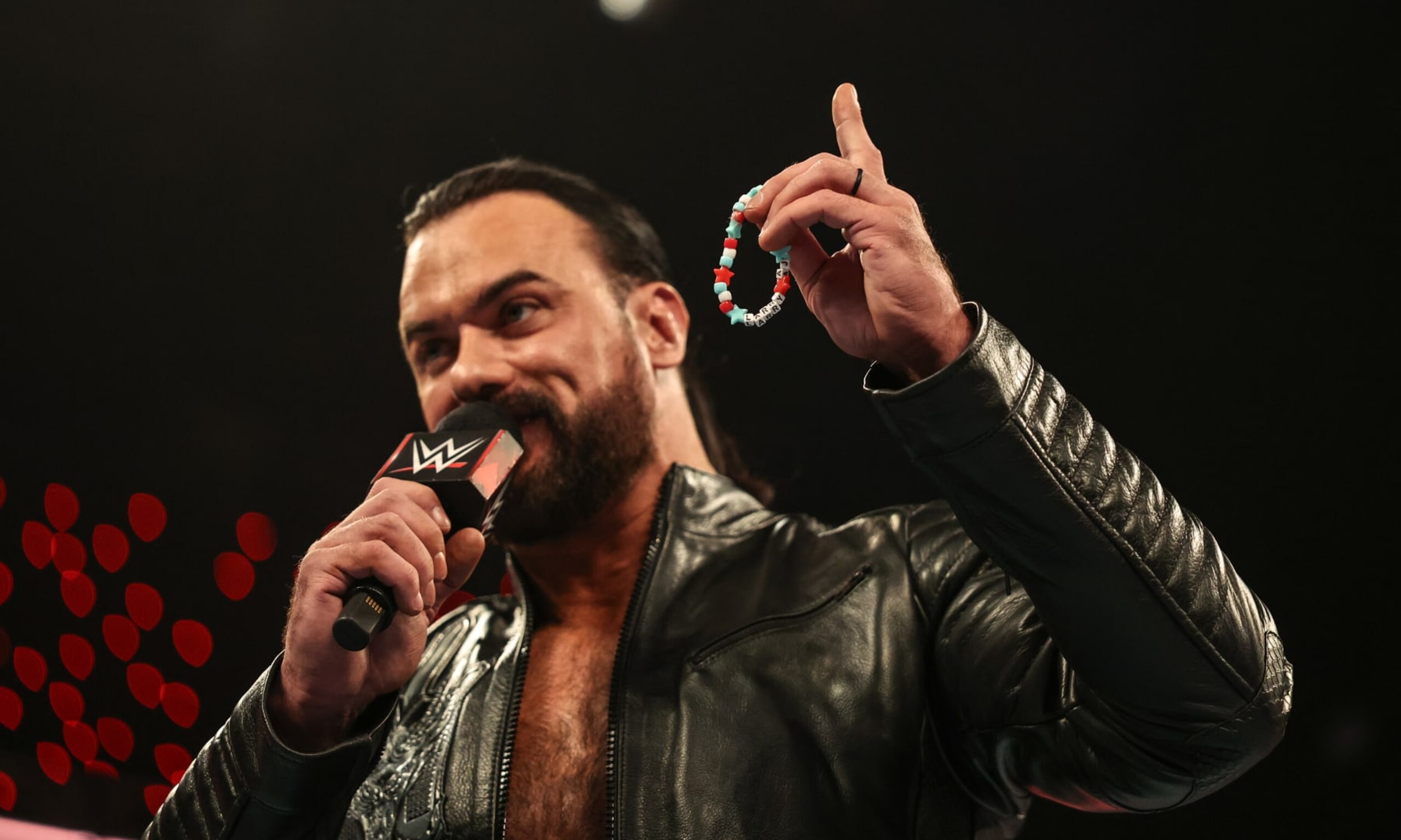 INDIANAPOLIS, INDIANA - JUNE 24: Drew McIntyre speaks while holding CM Punk's bracelet during Monday Night RAW at Gainbridge Fieldhouse on June 24, 2024 in Indianapolis, Indiana.  (Photo by WWE/Getty Images)