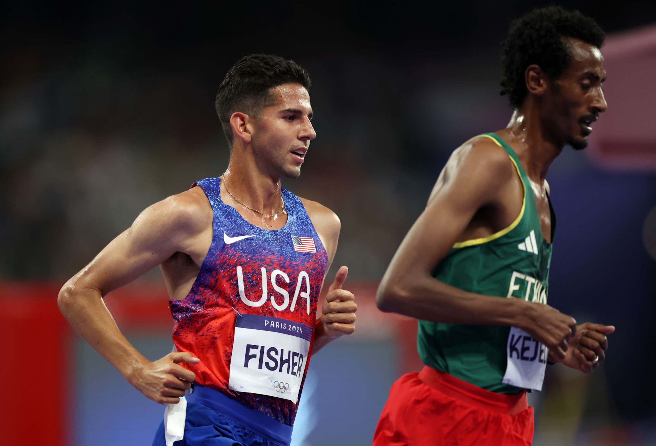 PARIS, FRANCE - AUGUST 02: Grant Fisher of Team United States competes during the during the Men's 10000 Metres final on day seven of the Olympic Games Paris 2024 at Stade de France on August 02, 2024 in Paris, France. (Photo by Christian Petersen/Getty Images) PARIS, FRANCE - AUGUST 02: Grant Fisher of Team United States competes during the during the Men's 10000 Metres final on day seven of the Olympic Games Paris 2024 at Stade de France on August 02, 2024 in Paris, France. (Photo by Christian Petersen/Getty Images)