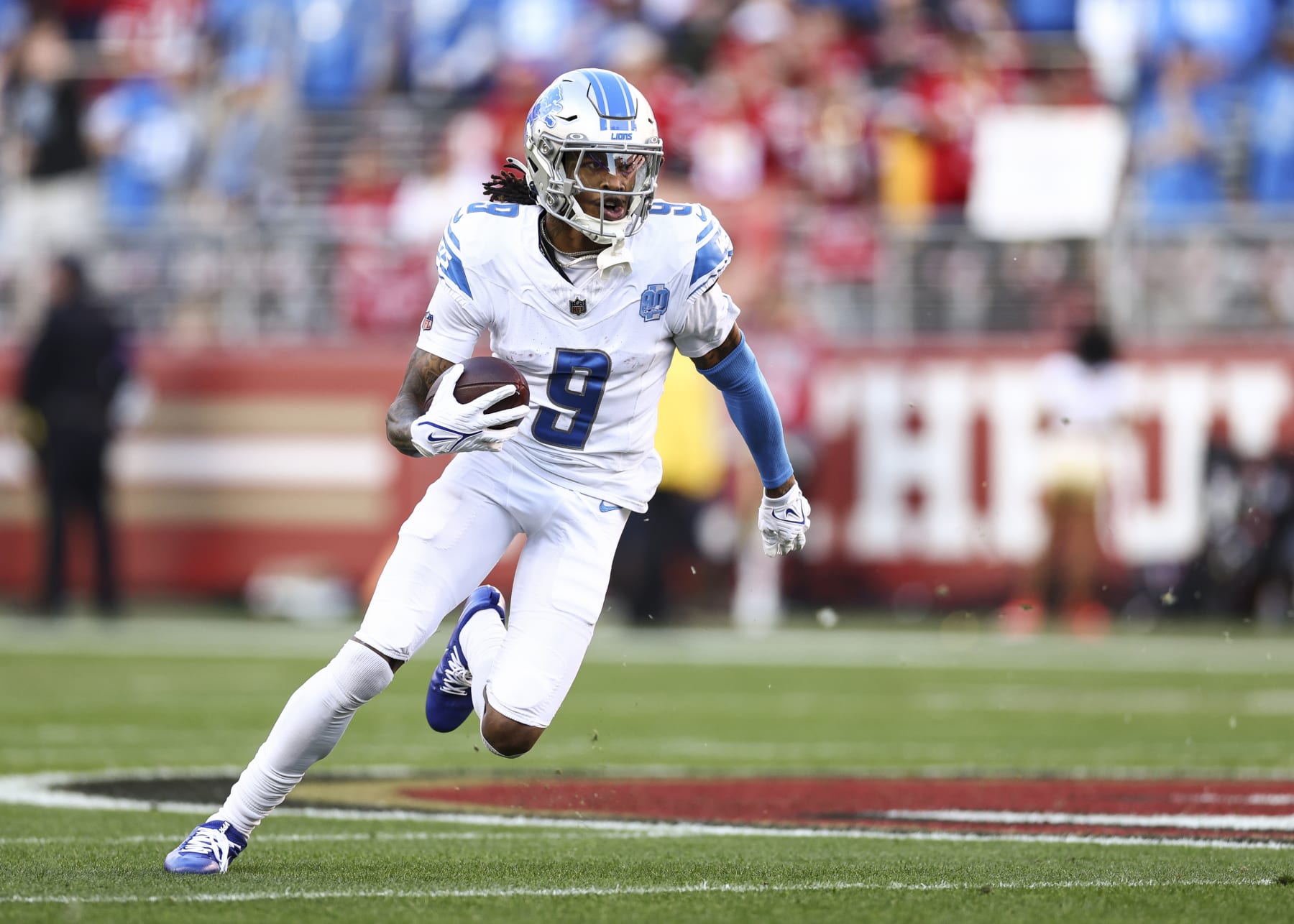 SANTA CLARA, CA - JANUARY 28: Jameson Williams #9 of the Detroit Lions carries the ball for a touchdown during the first quarter of the NFC Championship NFL football game against the San Francisco 49ers at Levi's Stadium on January 28, 2024 in Santa Clara, California. (Photo by Kevin Sabitus/Getty Images)