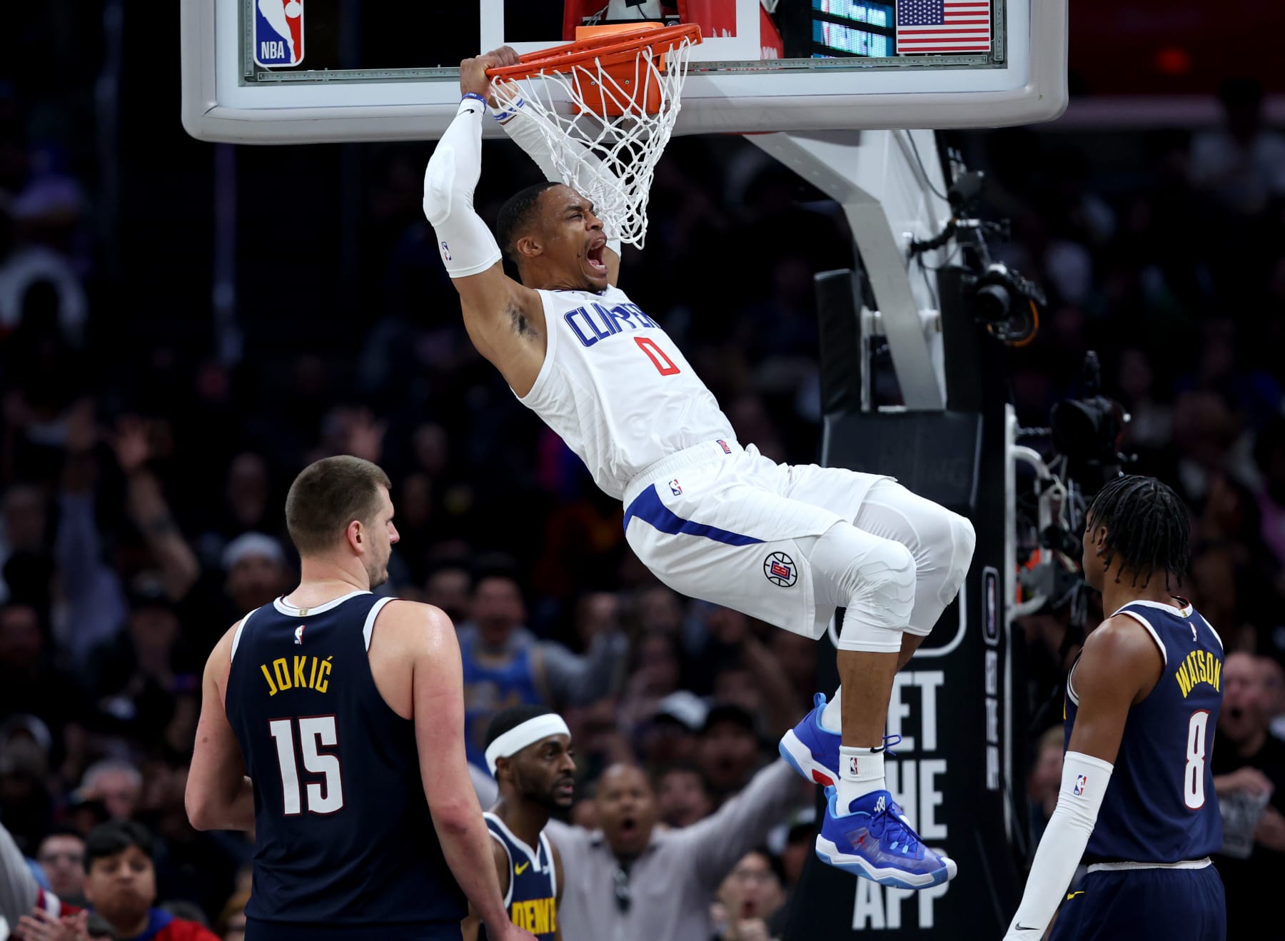 LOS ANGELES, CALIFORNIA - APRIL 04: Russell Westbrook #0 of the LA Clippers reacts to his dunk in front of Nikola Jokic #15 and Peyton Watson #8 of the Denver Nuggets during a 102-100 Clippers win at Crypto.com Arena on April 04, 2024 in Los Angeles, California. User is consenting to the terms and conditions of the Getty Images License Agreement. (Photo by Harry How/Getty Images)