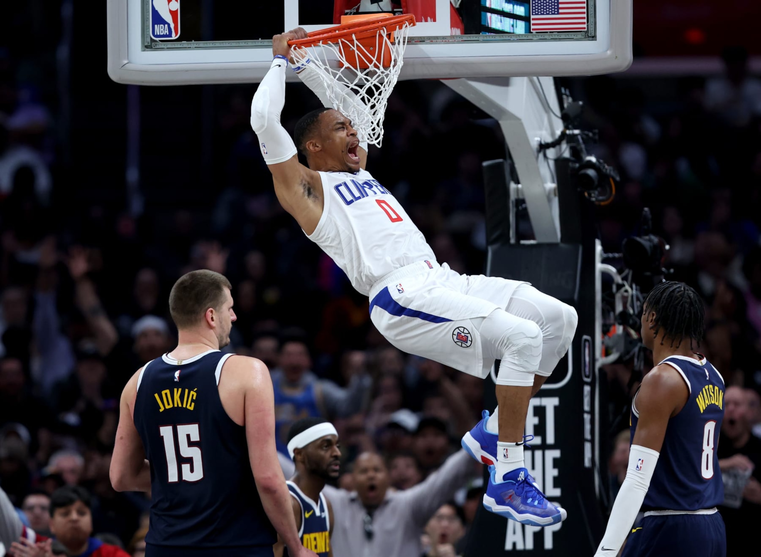 LOS ANGELES, CALIFORNIA - APRIL 04: Russell Westbrook #0 of the LA Clippers reacts to his dunk in front of Nikola Jokic #15 and Peyton Watson #8 of the Denver Nuggets during a 102-100 Clippers win at Crypto.com Arena on April 04, 2024 in Los Angeles, California. User is consenting to the terms and conditions of the Getty Images License Agreement. (Photo by Harry How/Getty Images)