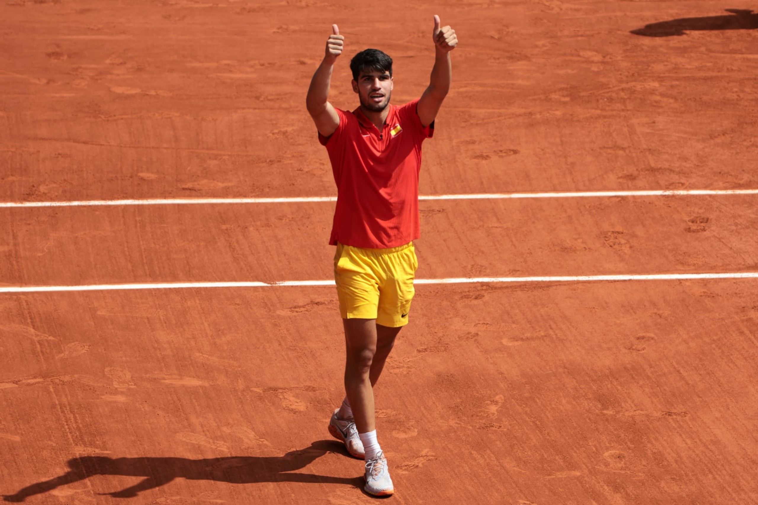 PARIS, FRANCE - AUGUST 02: Carlos Alcaraz of Team Spain celebrates match point during the Tennis Men's Singles Semifinal match against Felix Auger-Aliassime of Team Canada on day seven of the Olympic Games Paris 2024 at Roland Garros on August 02, 2024 in Paris, France. (Photo by Jean Catuffe/Getty Images)
