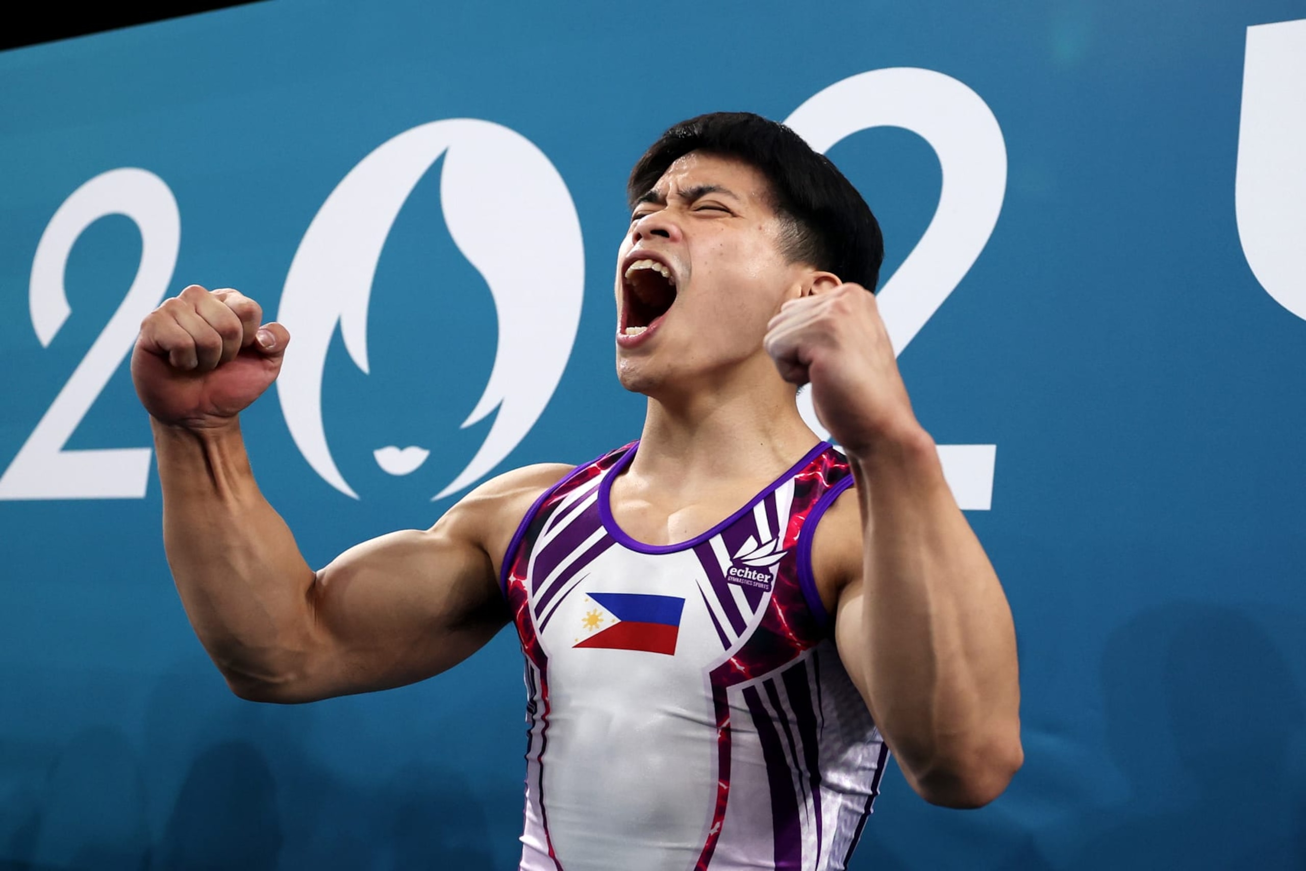 PARIS, FRANCE - AUGUST 03: Carlos Edriel Yulo of Team Philippines celebrates after finishing his routine during the Artistic Gymnastics Men's Floor Exercise Final on day eight of the Olympic Games Paris 2024 at Bercy Arena on August 03, 2024 in Paris, France. (Photo by Naomi Baker/Getty Images)