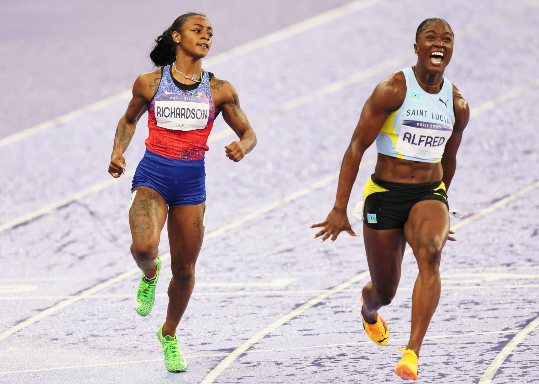 Saint-Lucia¿s Julien Alfred (R) wins ahead of US Sha'carri Richardson in the Women's 100m final of the athletics competition at the Paris 2024 Olympic Games, on Saturday 03 August 2024 in Paris, France. The Games of the XXXIII Olympiad are taking place in Paris from 26 July to 11 August. The Belgian delegation counts 165 athletes competing in 21 sports. BELGA PHOTO BENOIT DOPPAGNE (Photo by BENOIT DOPPAGNE / BELGA MAG / Belga via AFP) (Photo by BENOIT DOPPAGNE/BELGA MAG/AFP via Getty Images)