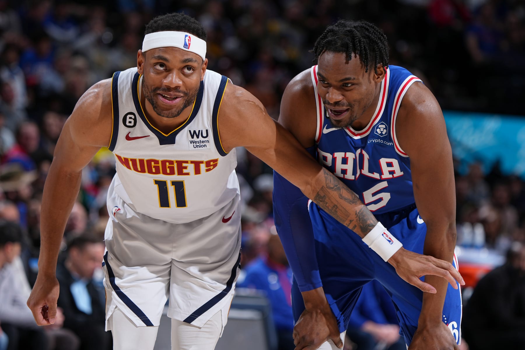 DENVER, CO - MARCH 27: Bruce Brown #11 of the Denver Nuggets and Danuel House Jr. #25 of the Philadelphia 76ers look on during the game on March 27, 2023 at the Ball Arena in Denver, Colorado. NOTE TO USER: User expressly acknowledges and agrees that, by downloading and/or using this Photograph, user is consenting to the terms and conditions of the Getty Images License Agreement. Mandatory Copyright Notice: Copyright 2023 NBAE (Photo by Garrett Ellwood/NBAE via Getty Images)