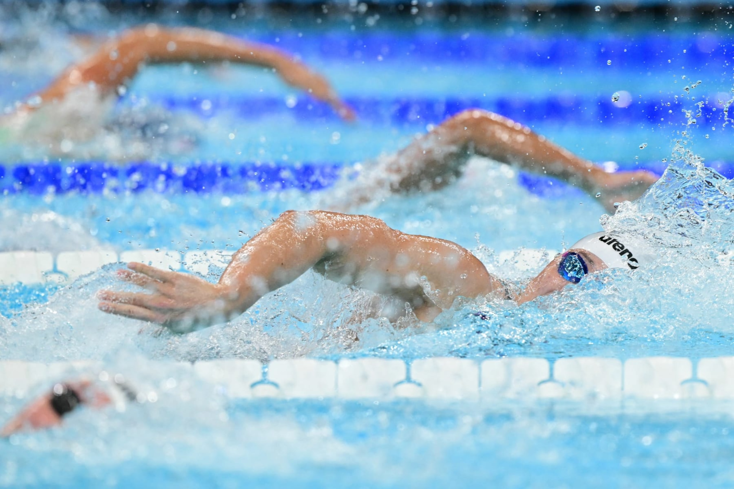 US' Torri Huske competes in a heat of the women's 100m freestyle swimming event during the Paris 2024 Olympic Games at the Paris La Defense Arena in Nanterre, west of Paris, on July 30, 2024. (Photo by François-Xavier MARIT / AFP) (Photo by FRANCOIS-XAVIER MARIT/AFP via Getty Images)