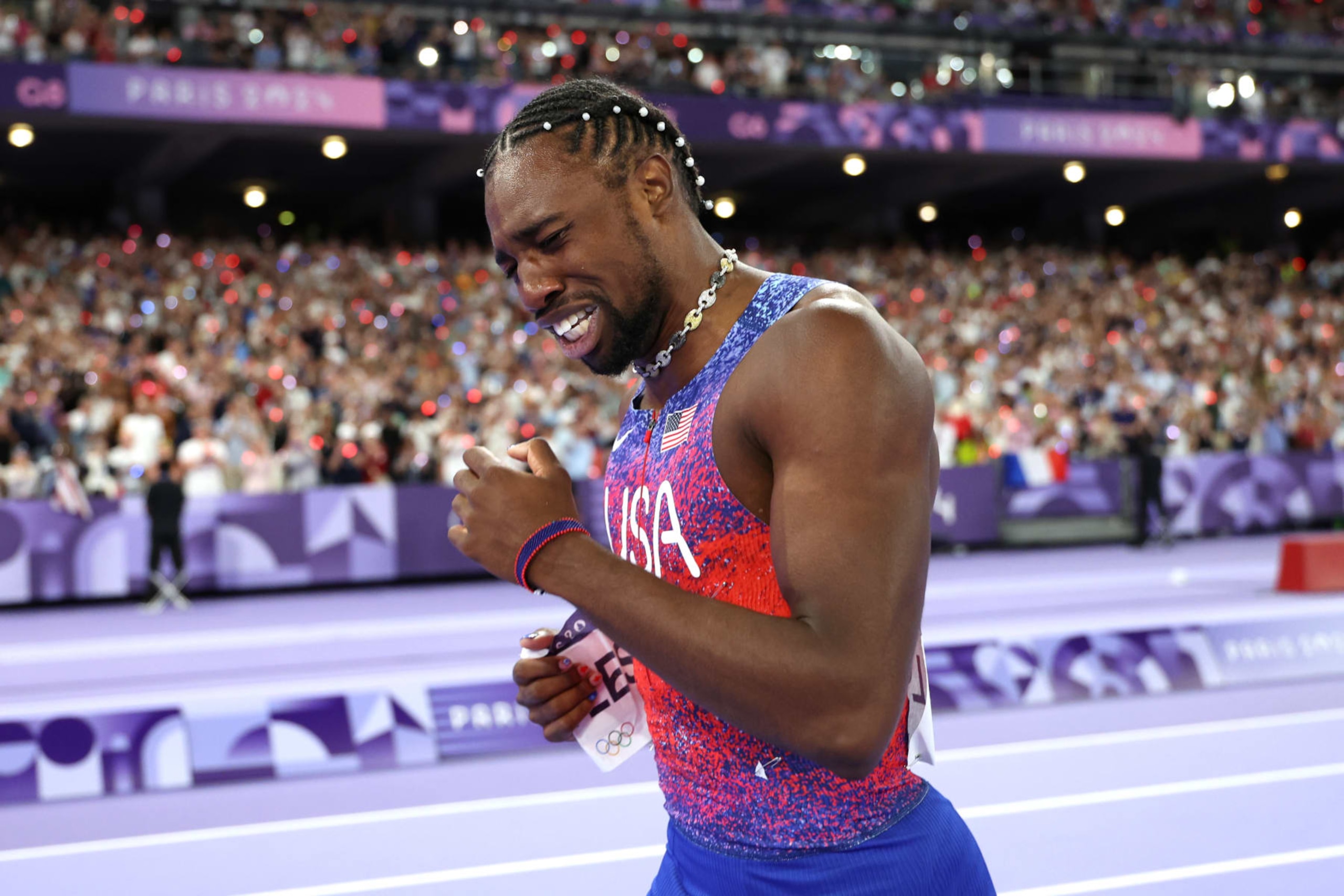 PARIS, FRANCE - AUGUST 04: Noah Lyles of Team United States celebrates winning the gold medal after competing the Men's 100m Final on day nine of the Olympic Games Paris 2024 at Stade de France on August 04, 2024 in Paris, France. (Photo by Christian Petersen/Getty Images)