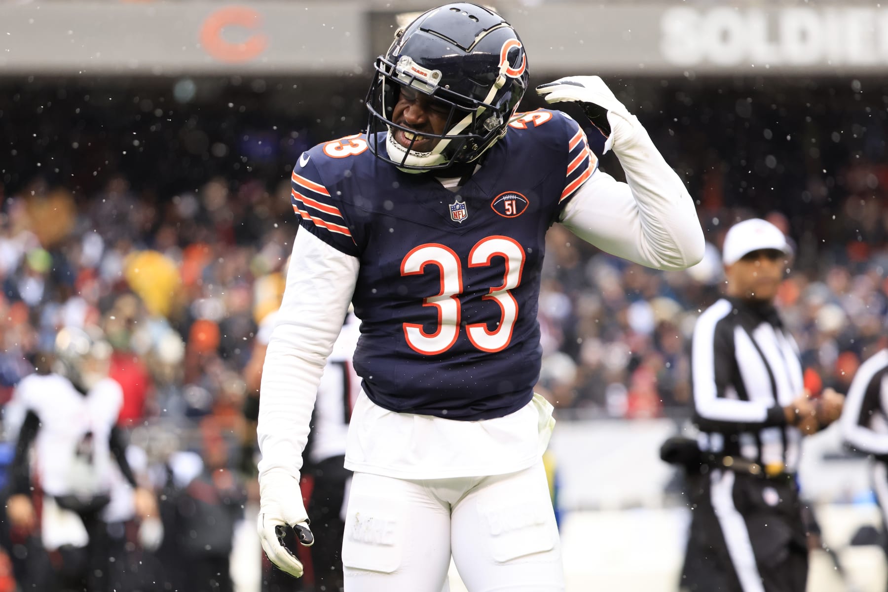 CHICAGO, ILLINOIS - DECEMBER 31: Jaylon Johnson #33 of the Chicago Bears reacts after a play during the first half against the Atlanta Falcons at Soldier Field on December 31, 2023 in Chicago, Illinois. (Photo by Justin Casterline/Getty Images)
