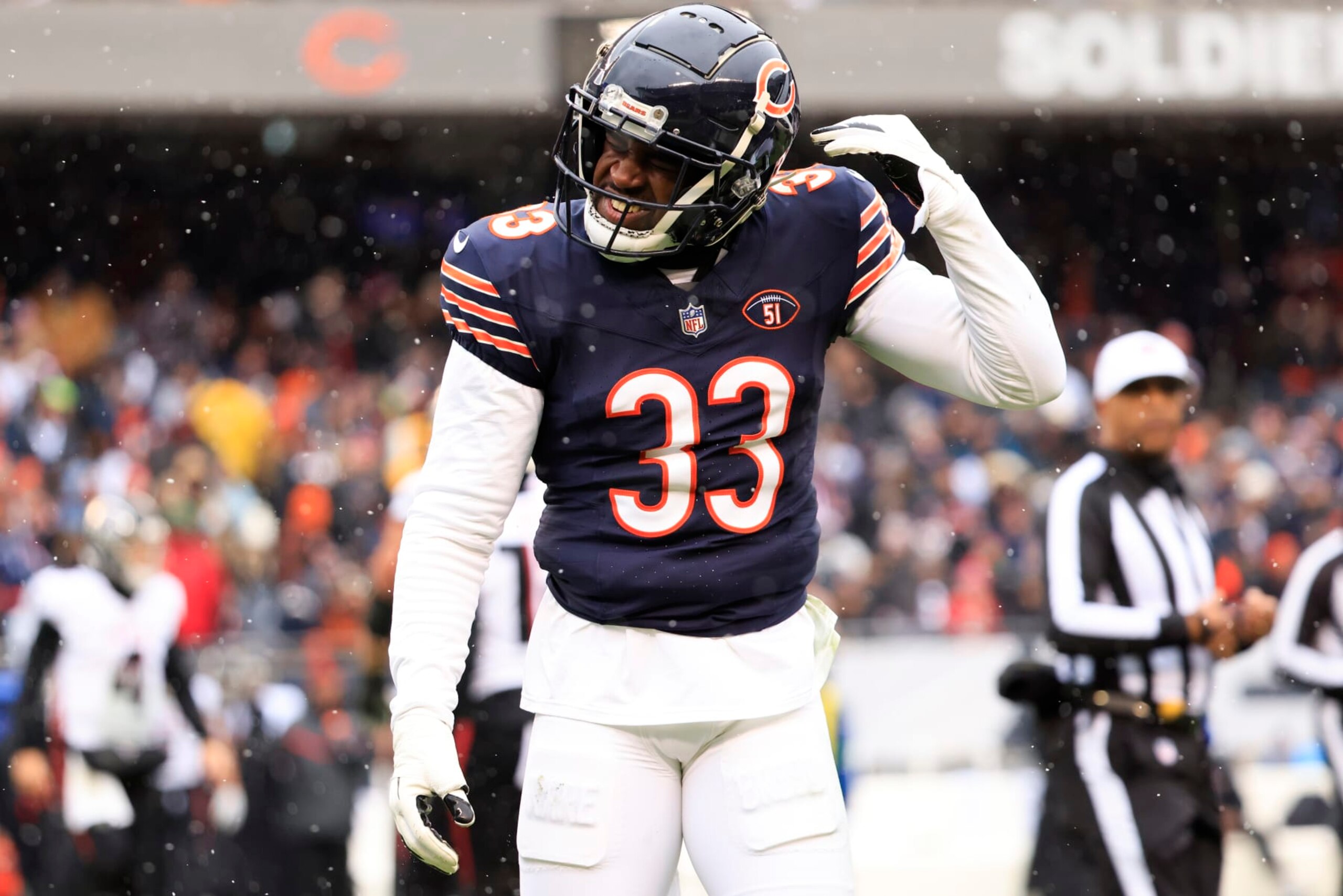 CHICAGO, ILLINOIS - DECEMBER 31: Jaylon Johnson #33 of the Chicago Bears reacts after a play during the first half against the Atlanta Falcons at Soldier Field on December 31, 2023 in Chicago, Illinois. (Photo by Justin Casterline/Getty Images)