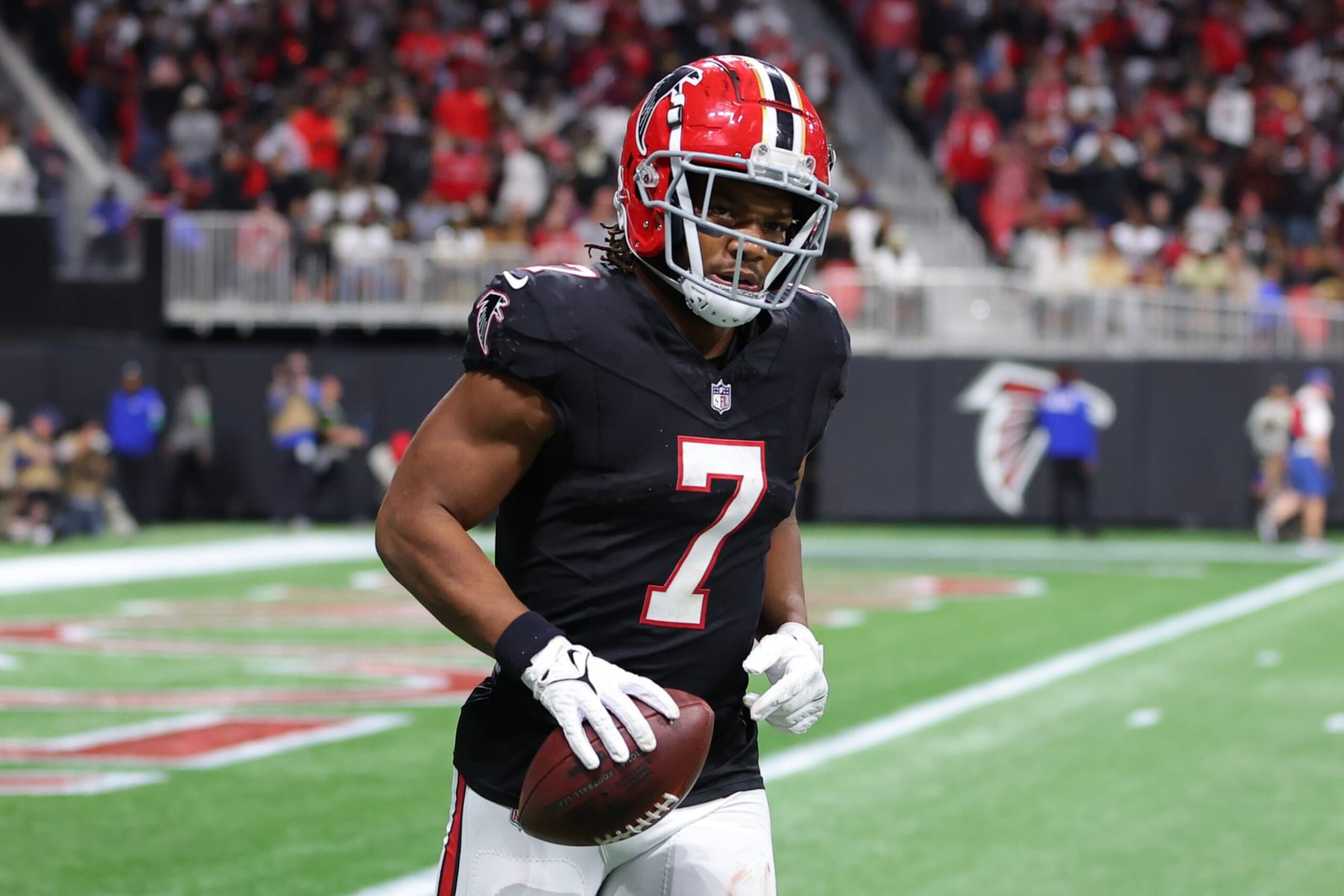 ATLANTA, GEORGIA - NOVEMBER 26: Bijan Robinson #7 of the Atlanta Falcons reacts after scoring a receiving touchdown in the fourth quarter of the game against the New Orleans Saints at Mercedes-Benz Stadium on November 26, 2023 in Atlanta, Georgia. (Photo by Kevin C. Cox/Getty Images)