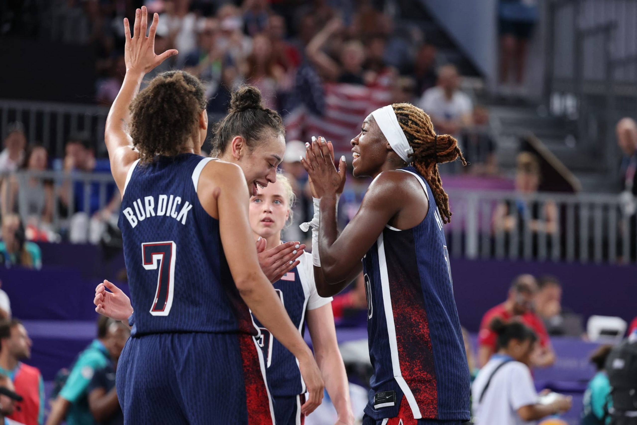 USA celebrate after winning the women's 3x3 basketball bronze medal game between Canada and USA during the Paris 2024 Olympic Games at La Concorde in Paris on August 5, 2024. (Photo by David GRAY / AFP) (Photo by DAVID GRAY/AFP via Getty Images)