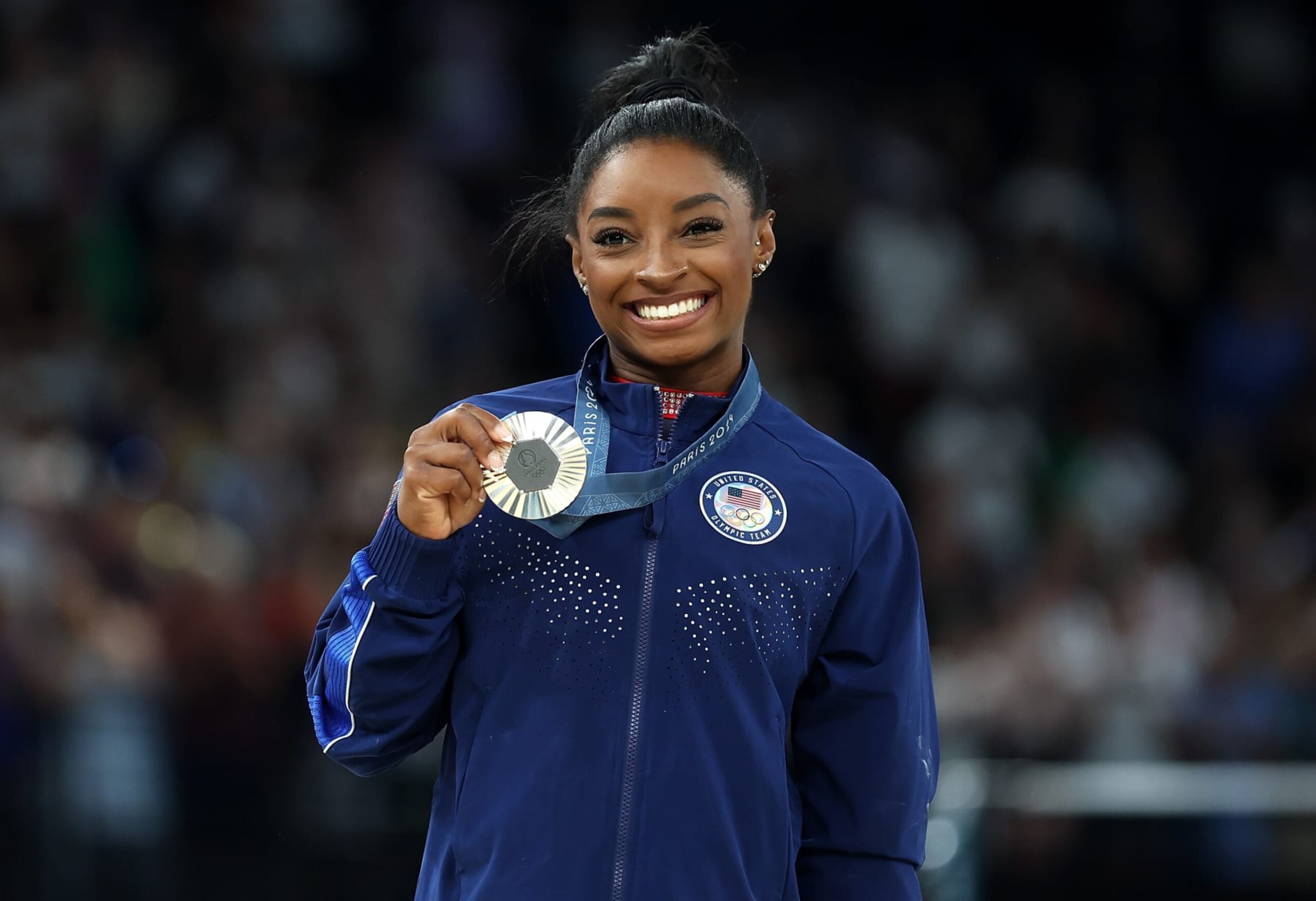 Silver medalist Simone Biles of the United States poses for photos during the victory ceremony of women's floor exercise of artistic gymnastics at the Paris 2024 Olympic Games in Paris, France, Aug. 5, 2024. (Photo by Cao Can/Xinhua via Getty Images) Silver medalist Simone Biles of the United States poses for photos during the victory ceremony of women's floor exercise of artistic gymnastics at the Paris 2024 Olympic Games in Paris, France, Aug. 5, 2024. (Photo by Cao Can/Xinhua via Getty Images)