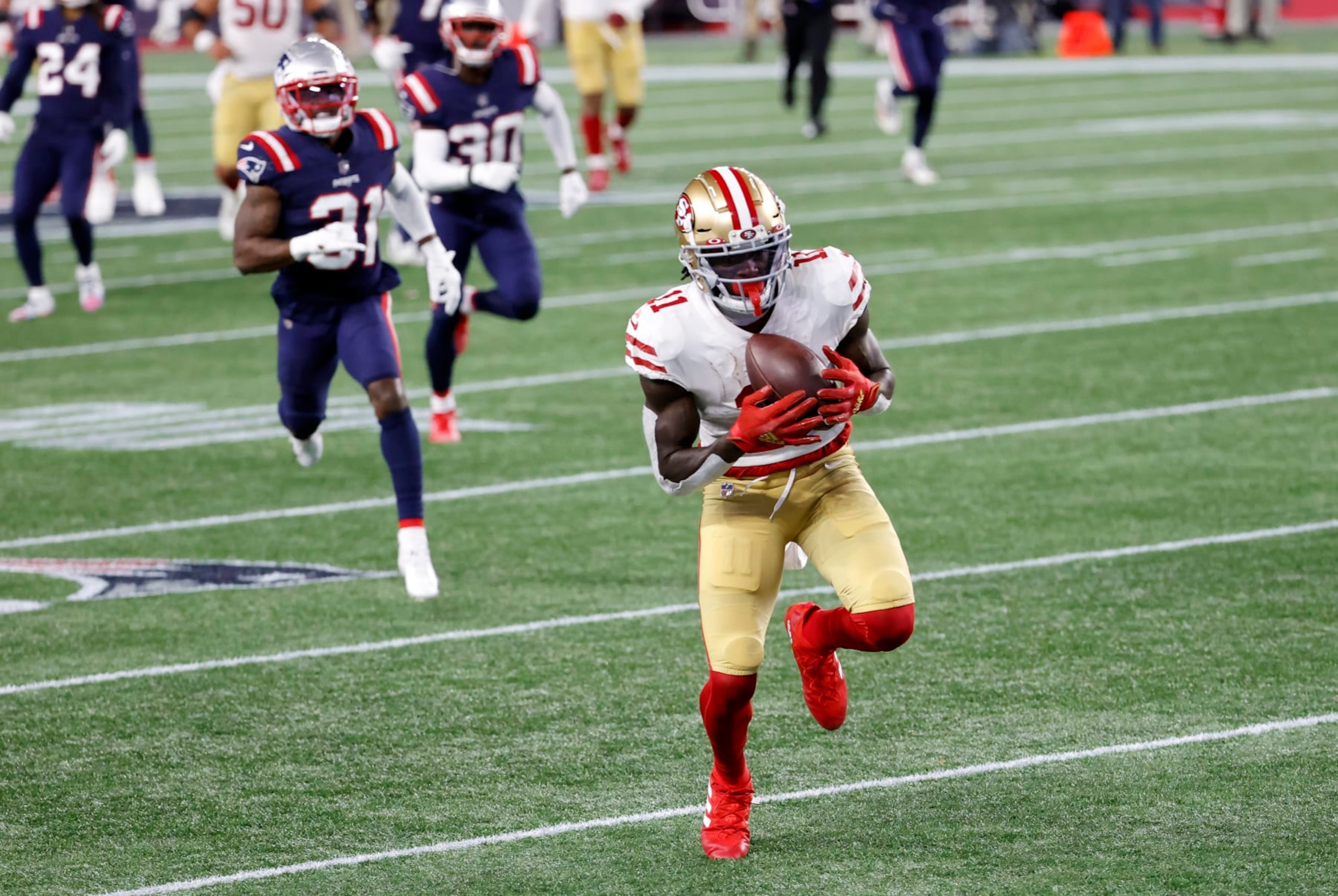 FOXBOROUGH, MA - OCTOBER 25: San Francisco 49ers wide receiver Brandon Aiyuk (11) hauls in a long pass during a game between the New England Patriots and the San Francisco 49ers on October 25, 2020, at Gillette Stadium in Foxborough, Massachusetts. (Photo by Fred Kfoury III/Icon Sportswire via Getty Images)