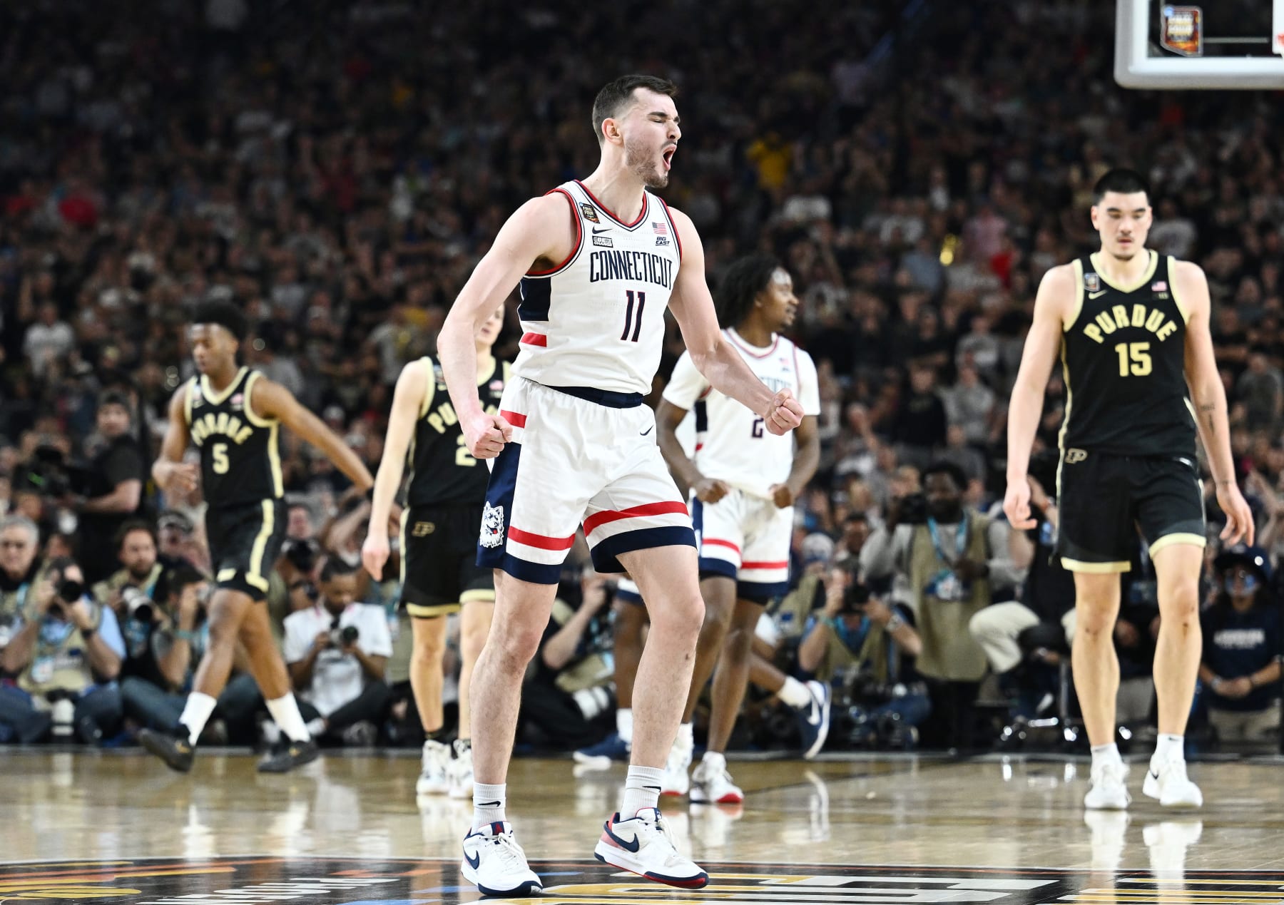 GLENDALE, ARIZONA - APRIL 08: Alex Karaban #11 of the Connecticut Huskies reacts during the second half in the NCAA Men's Basketball Tournament National Championship game at State Farm Stadium on April 08, 2024 in Glendale, Arizona. (Photo by Brett Wilhelm/NCAA Photos via Getty Images)