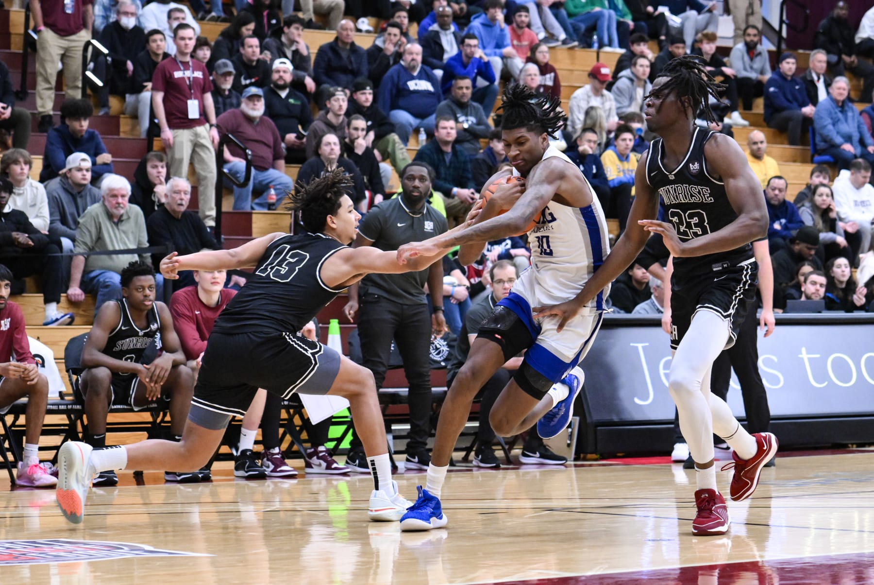 SPRINGFIELD, MA - JANUARY 14: Donnie Freeman of IMG (10) drives to the basket while being defended by Caleb Williams of Sunrise Christian (13) and Kany Tchanda of Sunrise Christian (23) during the first half of the Spalding Hoophall Classic high school basketball game between Sunrise Christian Academy and IMG Academy on January 14, 2024 at Blake Arena in Springfield, MA (Photo by John Jones/Icon Sportswire via Getty Images)
