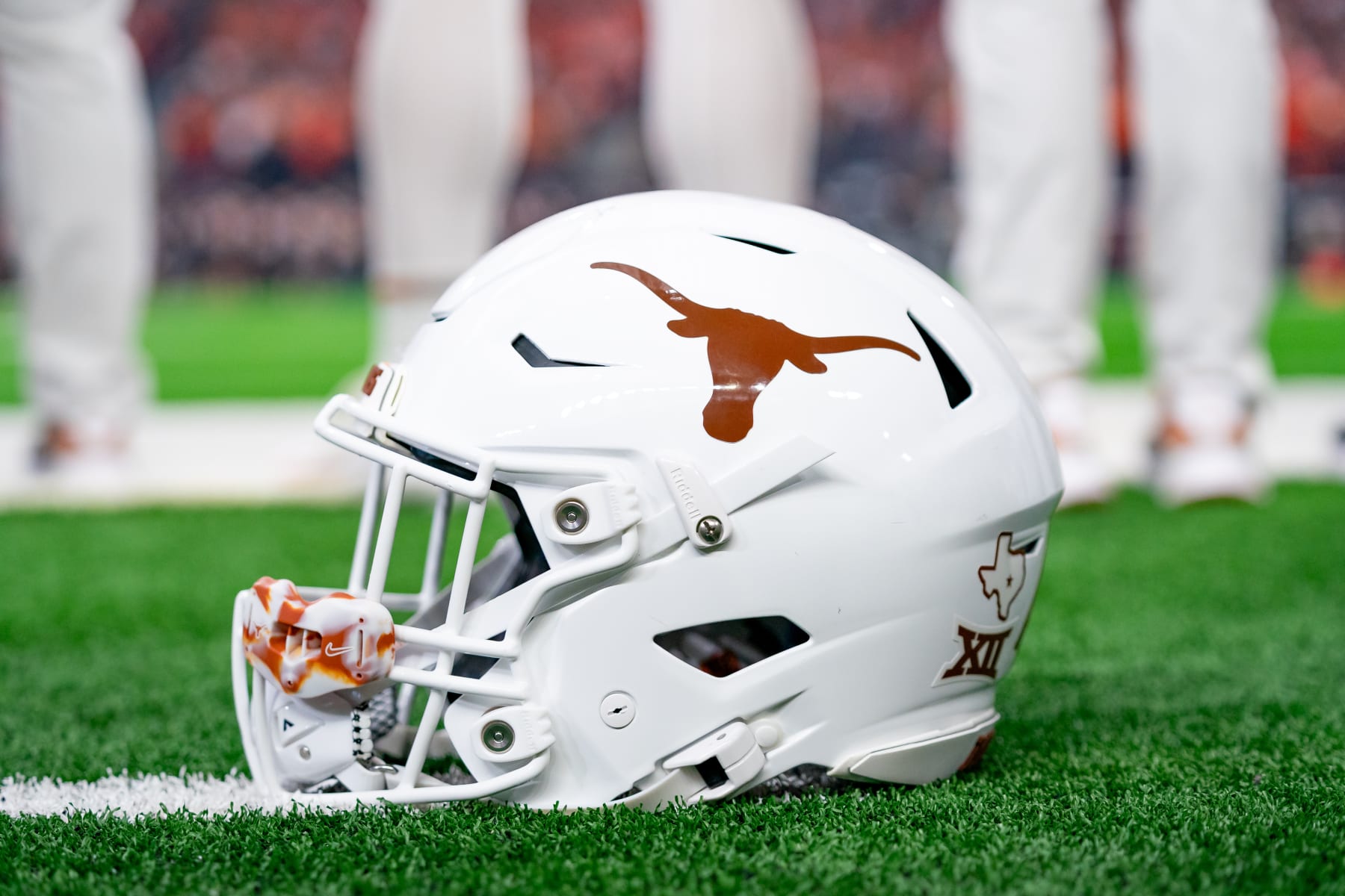 ARLINGTON, TX - DECEMBER 02: Texas Longhorns helmet sits on the sidelines during the Big 12 Championship game between the Texas Longhorns and the Oklahoma State Cowboys   on December 02, 2023 at AT&T Stadium in Arlington, TX. (Photo by Chris Leduc/Icon Sportswire via Getty Images)