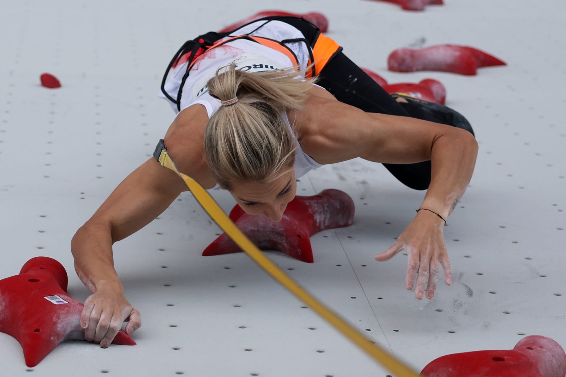 An overview shows Poland's Aleksandra Miroslaw competing to win the women's sport climbing speed final during the Paris 2024 Olympic Games at Le Bourget Sport Climbing Venue in Le Bourget on August 7, 2024. (Photo by Michael REAVES / POOL / AFP) (Photo by MICHAEL REAVES/POOL/AFP via Getty Images)