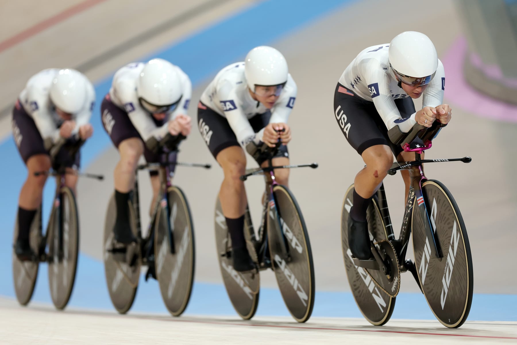 PARIS, FRANCE - AUGUST 07: Jennifer Valente, Lily Williams, Chloe Dygert and Kristen Faulkner of Team United States compete during the Women's Team Pursuit First Round on day twelve of the Olympic Games Paris 2024 at Saint-Quentin-en-Yvelines Velodrome on August 07, 2024 in Paris, France. (Photo by Tim de Waele/Getty Images)