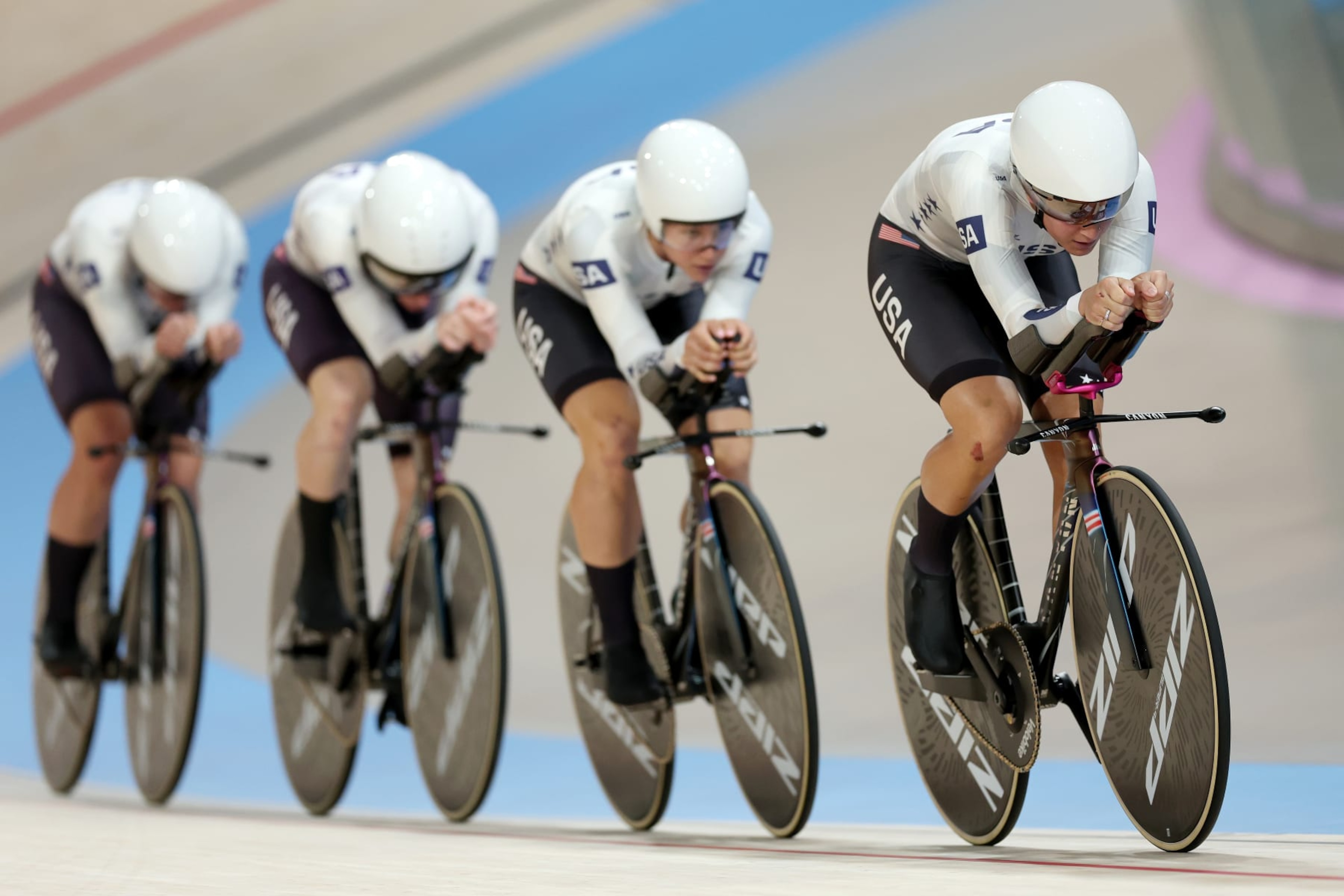 PARIS, FRANCE - AUGUST 07: Jennifer Valente, Lily Williams, Chloe Dygert and Kristen Faulkner of Team United States compete during the Women's Team Pursuit First Round on day twelve of the Olympic Games Paris 2024 at Saint-Quentin-en-Yvelines Velodrome on August 07, 2024 in Paris, France. (Photo by Tim de Waele/Getty Images)
