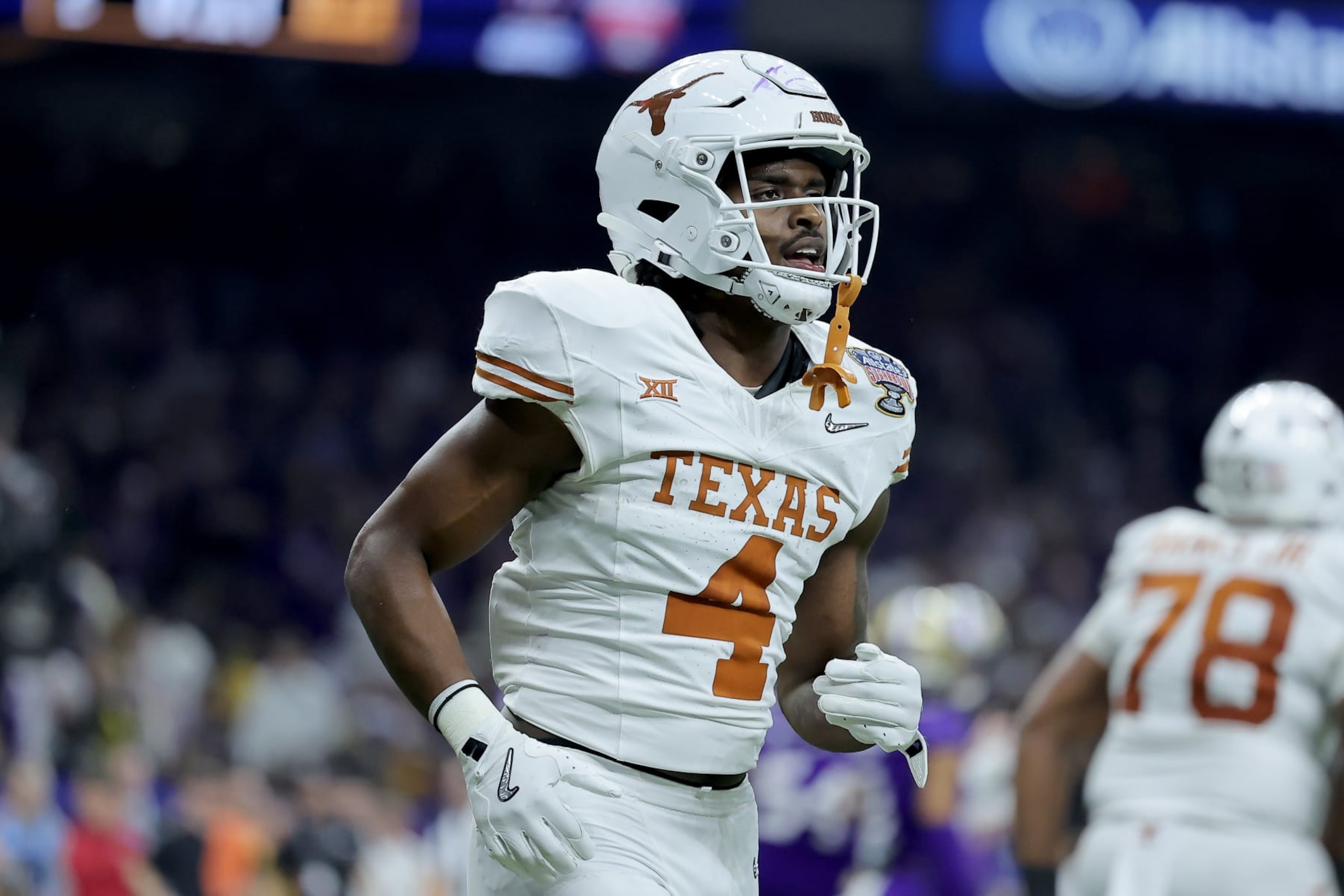 NEW ORLEANS, LOUISIANA - JANUARY 01: CJ Baxter #4 of the Texas Longhorns reacts after a touchdown during the second quarter against the Washington Huskies during the CFP Semifinal Allstate Sugar Bowl at Caesars Superdome on January 01, 2024 in New Orleans, Louisiana. (Photo by Jonathan Bachman/Getty Images) NEW ORLEANS, LOUISIANA - JANUARY 01: CJ Baxter #4 of the Texas Longhorns reacts after a touchdown during the second quarter against the Washington Huskies during the CFP Semifinal Allstate Sugar Bowl at Caesars Superdome on January 01, 2024 in New Orleans, Louisiana. (Photo by Jonathan Bachman/Getty Images)