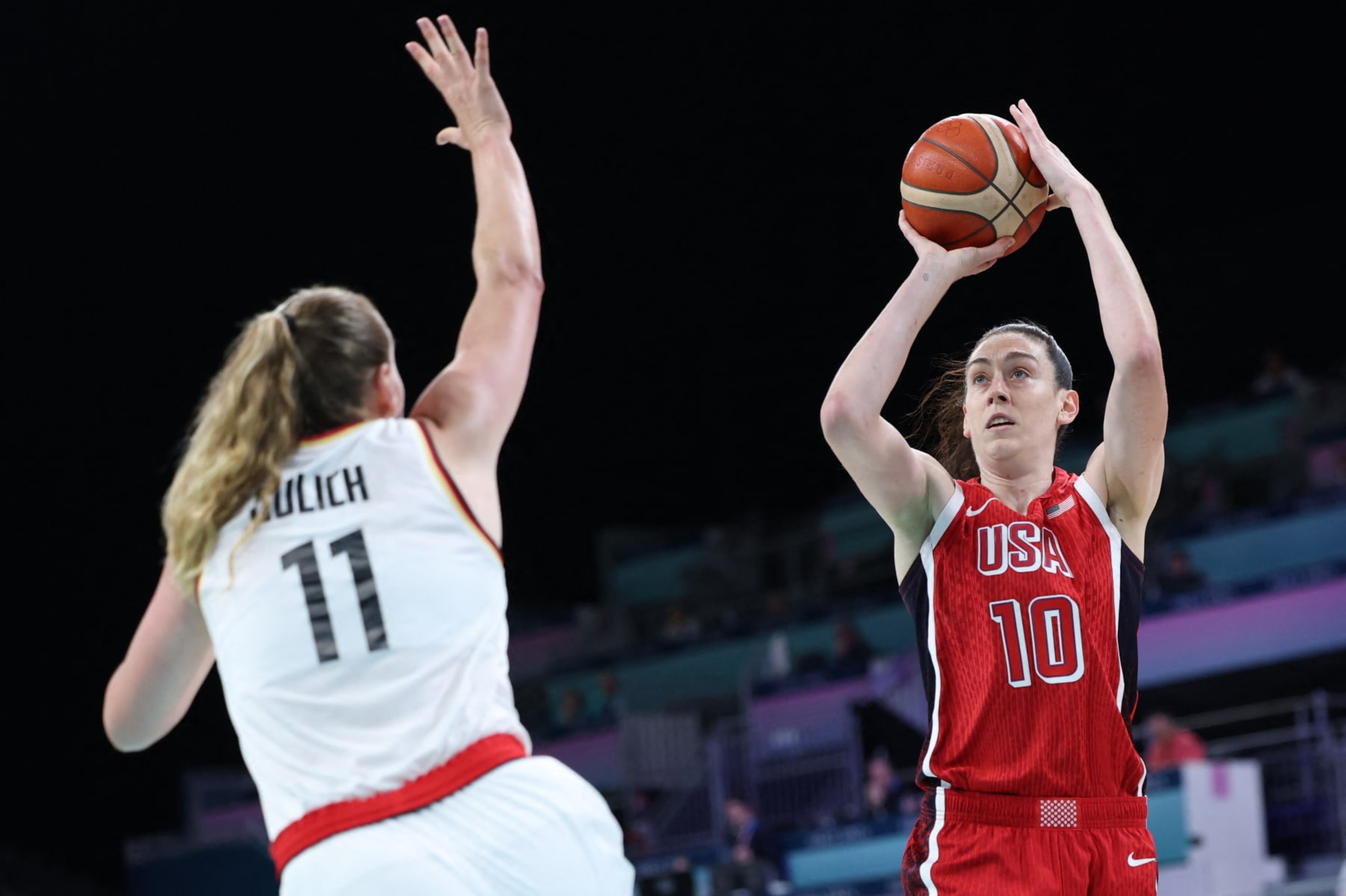 USA's #10 Breanna Stewart takes a shot in the women's preliminary round group C basketball match between Germany and USA during the Paris 2024 Olympic Games at the Pierre-Mauroy stadium in Villeneuve-d'Ascq, northern France, on August 4, 2024. (Photo by Thomas COEX / AFP) (Photo by THOMAS COEX/AFP via Getty Images) USA's #10 Breanna Stewart takes a shot in the women's preliminary round group C basketball match between Germany and USA during the Paris 2024 Olympic Games at the Pierre-Mauroy stadium in Villeneuve-d'Ascq, northern France, on August 4, 2024. (Photo by Thomas COEX / AFP) (Photo by THOMAS COEX/AFP via Getty Images)