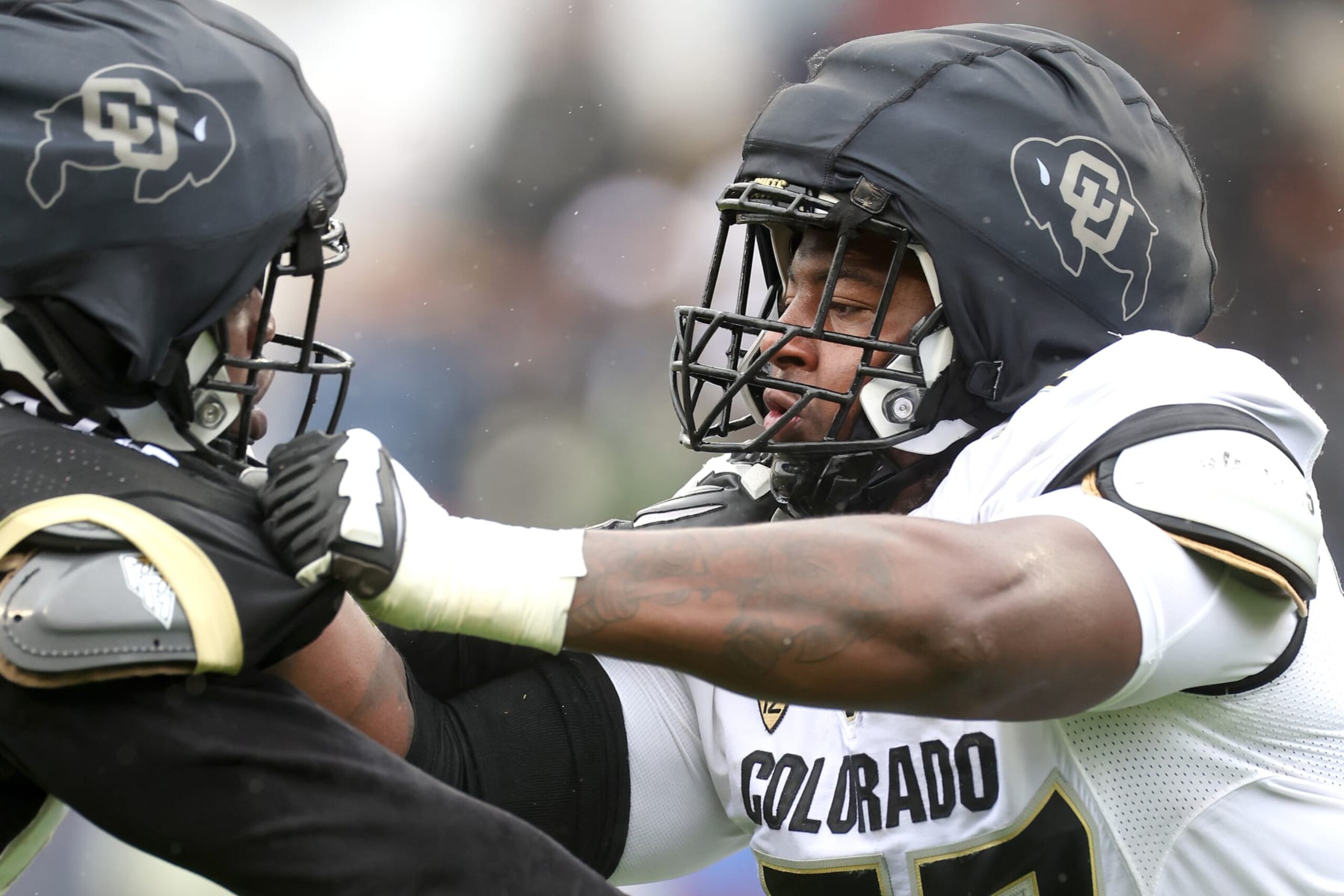 BOULDER, COLORADO - APRIL 27: Jordan Seaton #77 of the Colorado Buffaloes blocks during their spring game at Folsom Field on April 27, 2024 in Boulder, Colorado.  (Photo by Matthew Stockman/Getty Images)