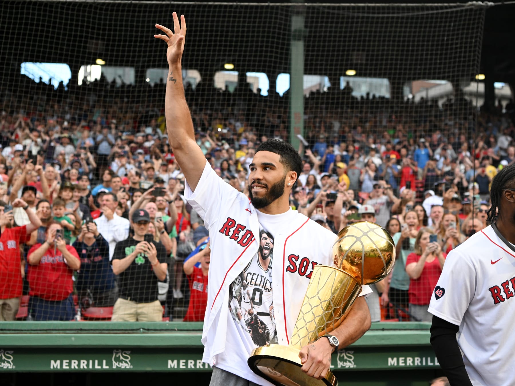 BOSTON, MASSACHUSETTS - JUNE 24: Jayson Tatum #0 of the Boston Celtics walks onto the field for a pregame ceremony before a game between the Toronto Blue Jays and the Boston Red Sox at Fenway Park on June 24, 2024 in Boston, Massachusetts. (Photo by Brian Fluharty/Getty Images)