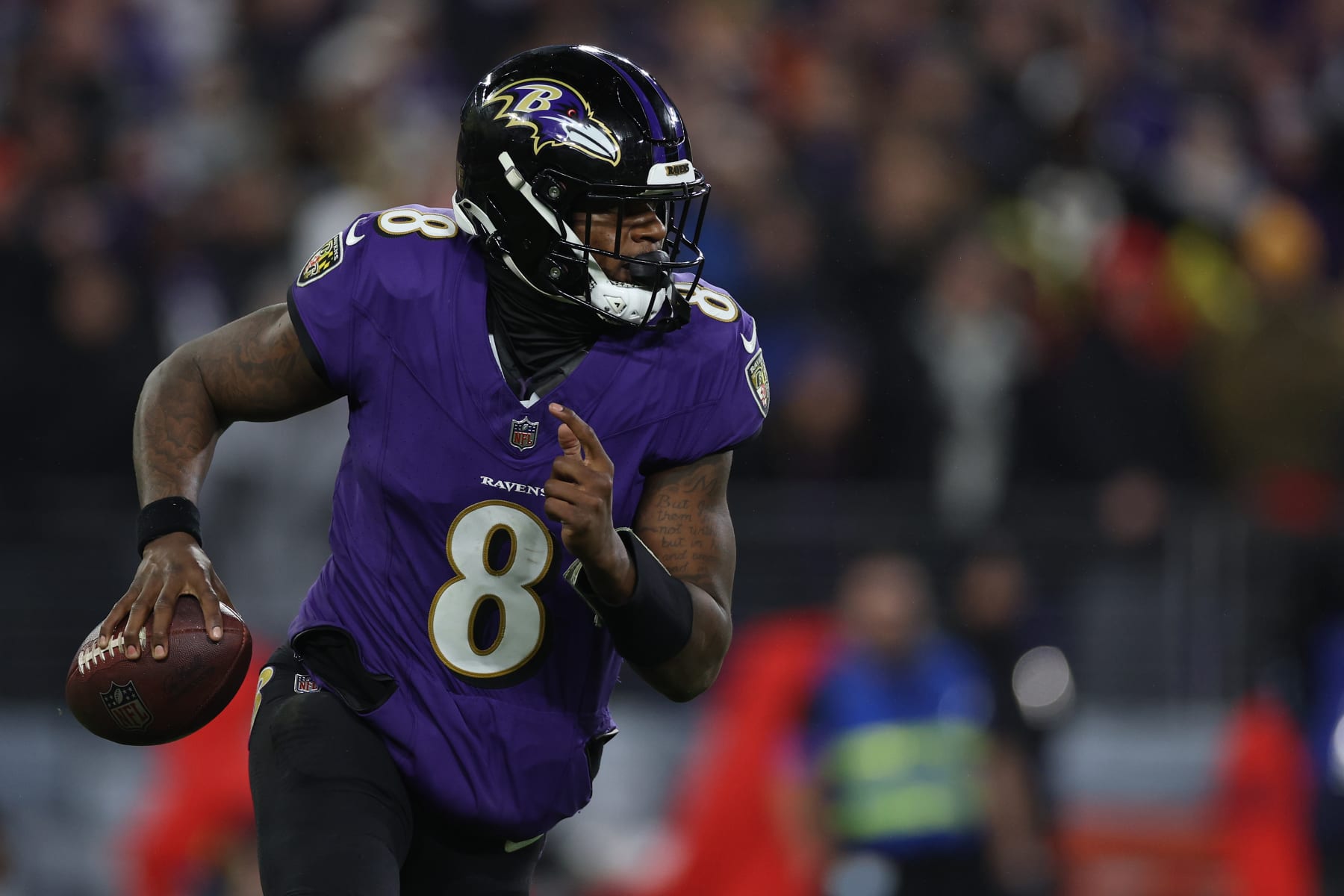 BALTIMORE, MARYLAND - JANUARY 28: Lamar Jackson #8 of the Baltimore Ravens rushes with the ball against the Kansas City Chiefs in the AFC Championship Game at M&T Bank Stadium on January 28, 2024 in Baltimore, Maryland. (Photo by Patrick Smith/Getty Images)