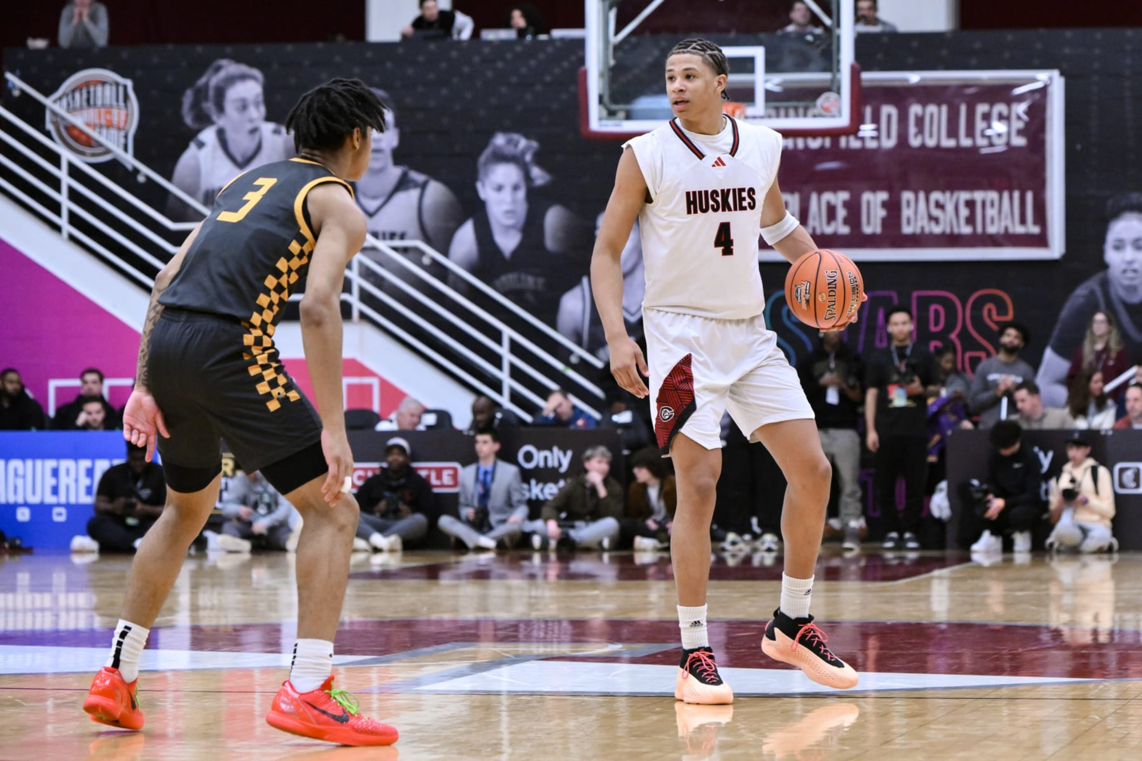 SPRINGFIELD, MA - JANUARY 13: Carter Bryant of Corona Centennial (4) sets the play as Milan Dean of Archbishop Wood HS (3) defends during the first half of the Spalding Hoophall Classic high school basketball game between Archbishop Wood and Corona Centennial on January 13, 2024 at Blake Arena in Springfield, MA (Photo by John Jones/Icon Sportswire via Getty Images) SPRINGFIELD, MA - JANUARY 13: Carter Bryant of Corona Centennial (4) sets the play as Milan Dean of Archbishop Wood HS (3) defends during the first half of the Spalding Hoophall Classic high school basketball game between Archbishop Wood and Corona Centennial on January 13, 2024 at Blake Arena in Springfield, MA (Photo by John Jones/Icon Sportswire via Getty Images)