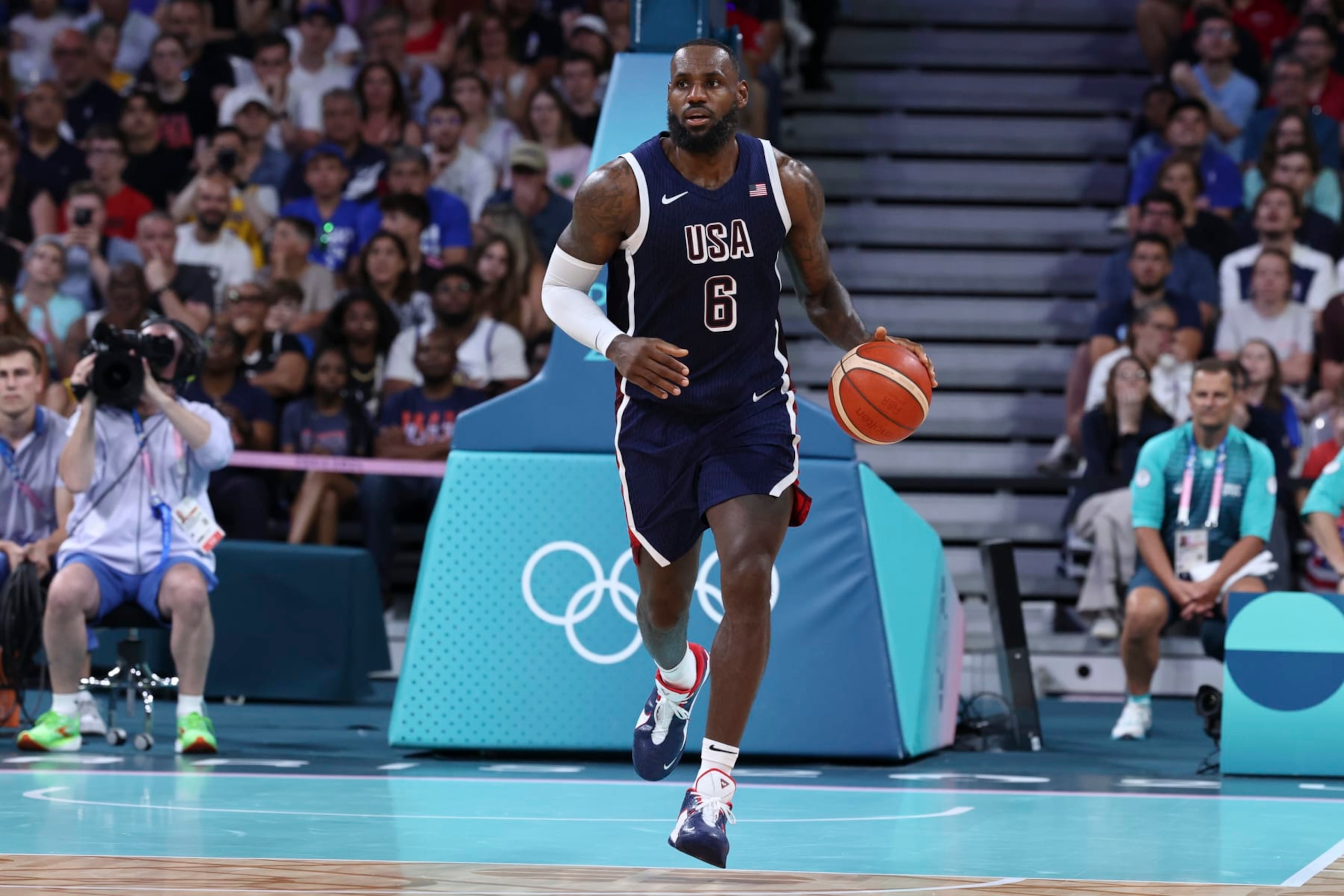 LILLE, FRANCE - JULY 28: LeBron James #6 of Team USA dribbles the ball during the Men's Group Phase - Group C match between Serbia and USA on Day 2 of the Olympic Games Paris 2024 at Stade Pierre Mauroy on July 28, 2024 in Lille, France. (Photo by Catherine Steenkeste/Getty Images) LILLE, FRANCE - JULY 28: LeBron James #6 of Team USA dribbles the ball during the Men's Group Phase - Group C match between Serbia and USA on Day 2 of the Olympic Games Paris 2024 at Stade Pierre Mauroy on July 28, 2024 in Lille, France. (Photo by Catherine Steenkeste/Getty Images)