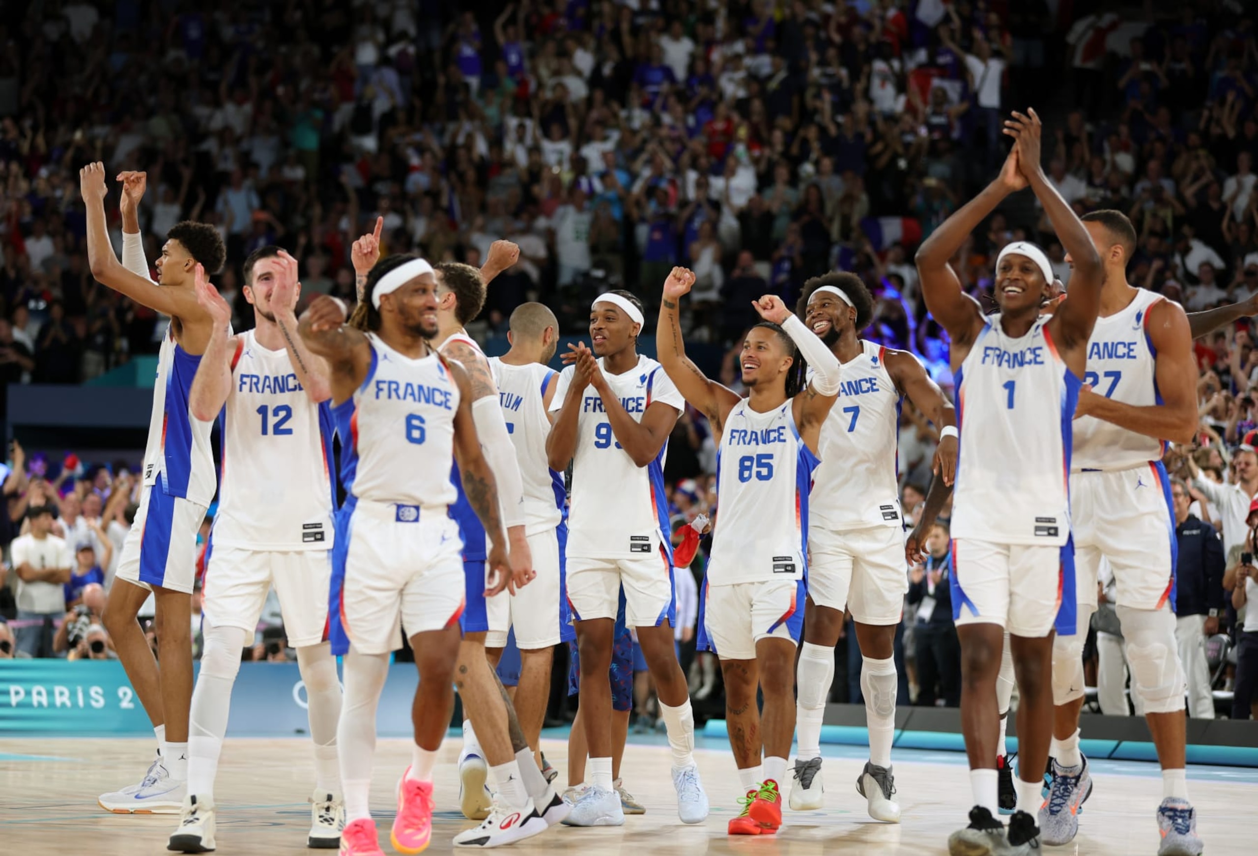 PARIS, FRANCE - AUGUST 08: Team France celebrats their victory and entry into the Final during the Men's Semifinal Game between France and Germany on day thirteen of the Olympic Games Paris 2024 at Bercy Arena on August 08, 2024 in Paris, France. (Photo by Christina Pahnke - sampics/Getty Images) PARIS, FRANCE - AUGUST 08: Team France celebrats their victory and entry into the Final during the Men's Semifinal Game between France and Germany on day thirteen of the Olympic Games Paris 2024 at Bercy Arena on August 08, 2024 in Paris, France. (Photo by Christina Pahnke - sampics/Getty Images)
