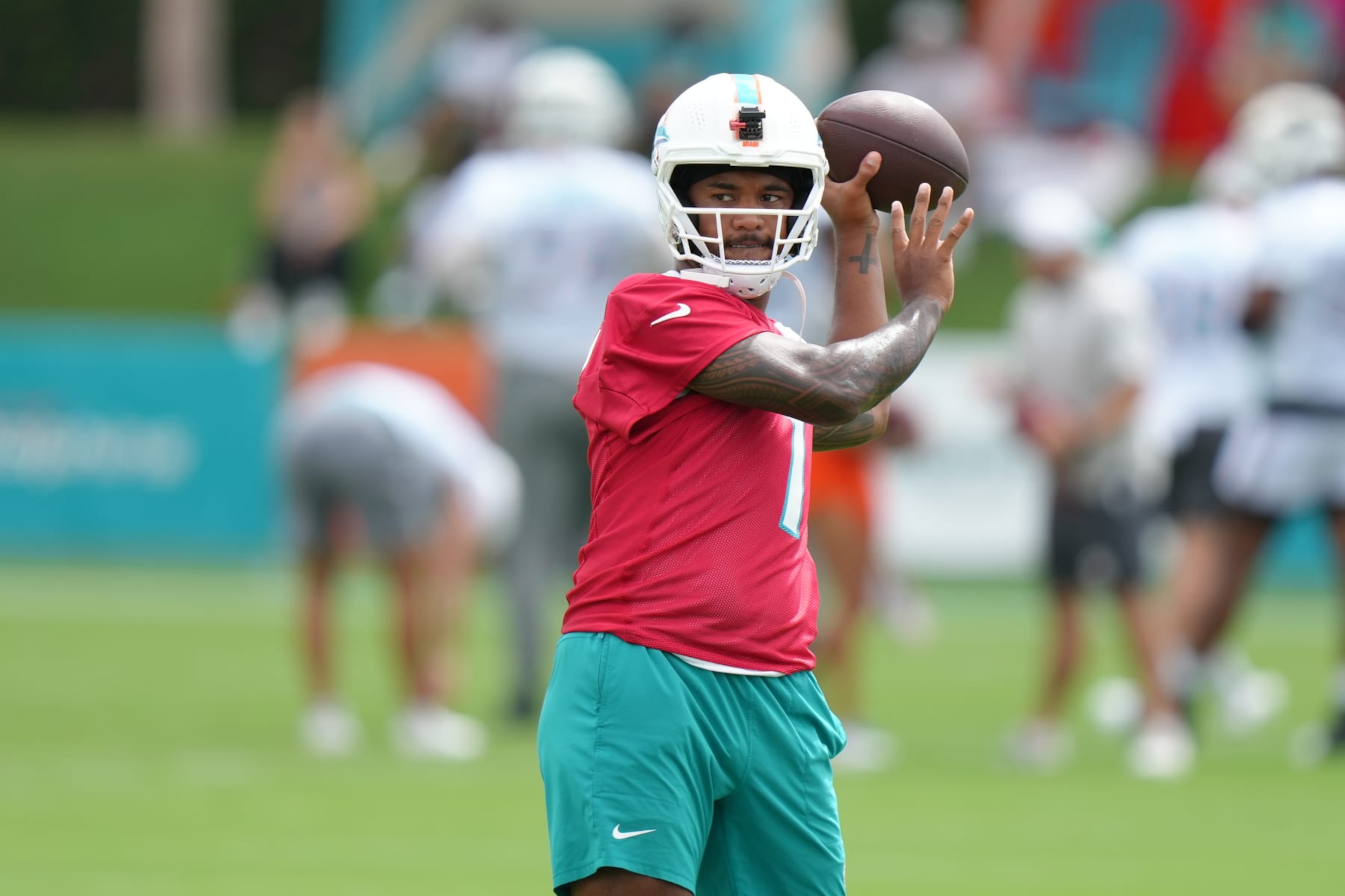 MIAMI GARDENS, FL - AUGUST 01: Miami Dolphins quarterback Tua Tagovailoa (1) throws passes during Dolphins Training Camp on Thursday, August 1, 2024 at Baptist Health Training Complex in Miami Gardens, Fla. (Photo by Peter Joneleit/Icon Sportswire via Getty Images)
